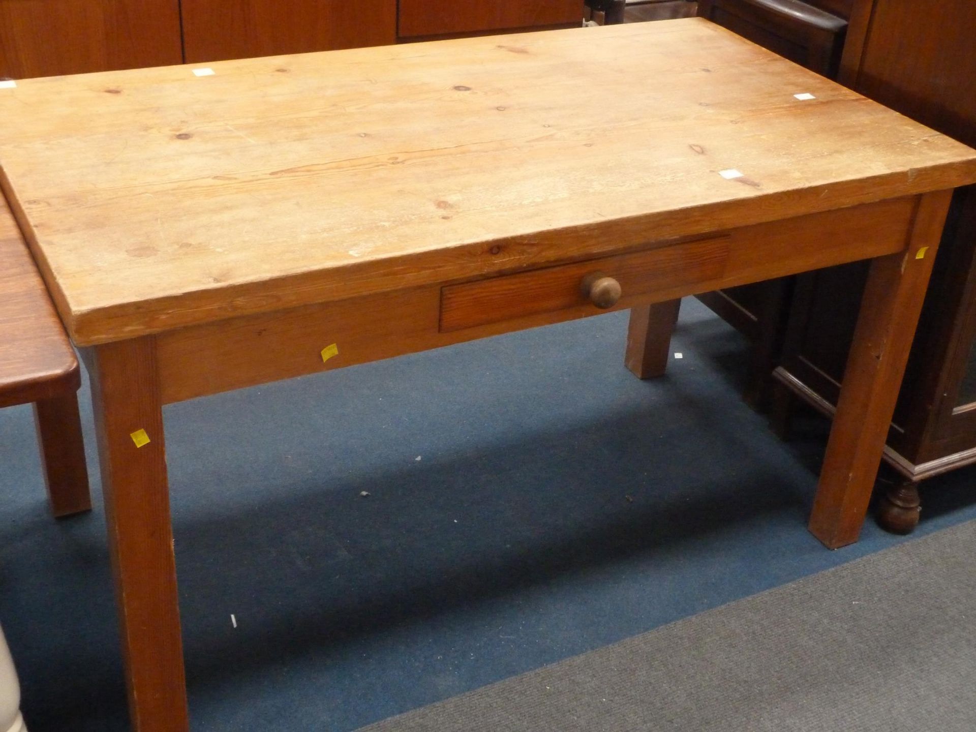 A large Pine Table (H 77cm, W 136.5cm, D 75cm) (est. £60-£80)