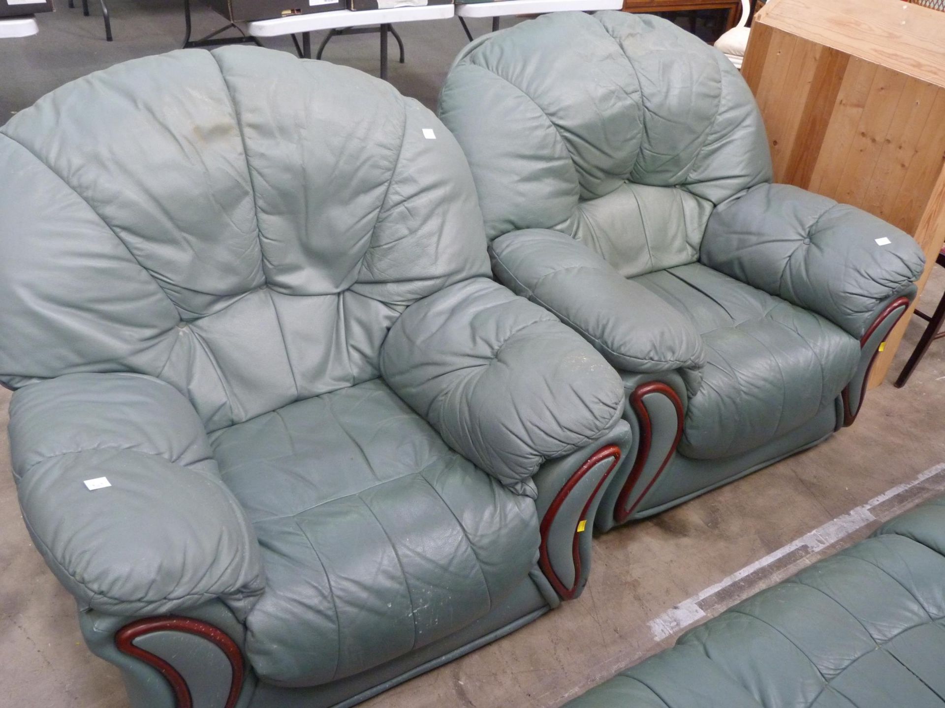 A green faux leather large deep easy three piece lounge suite. (est £30-£50)