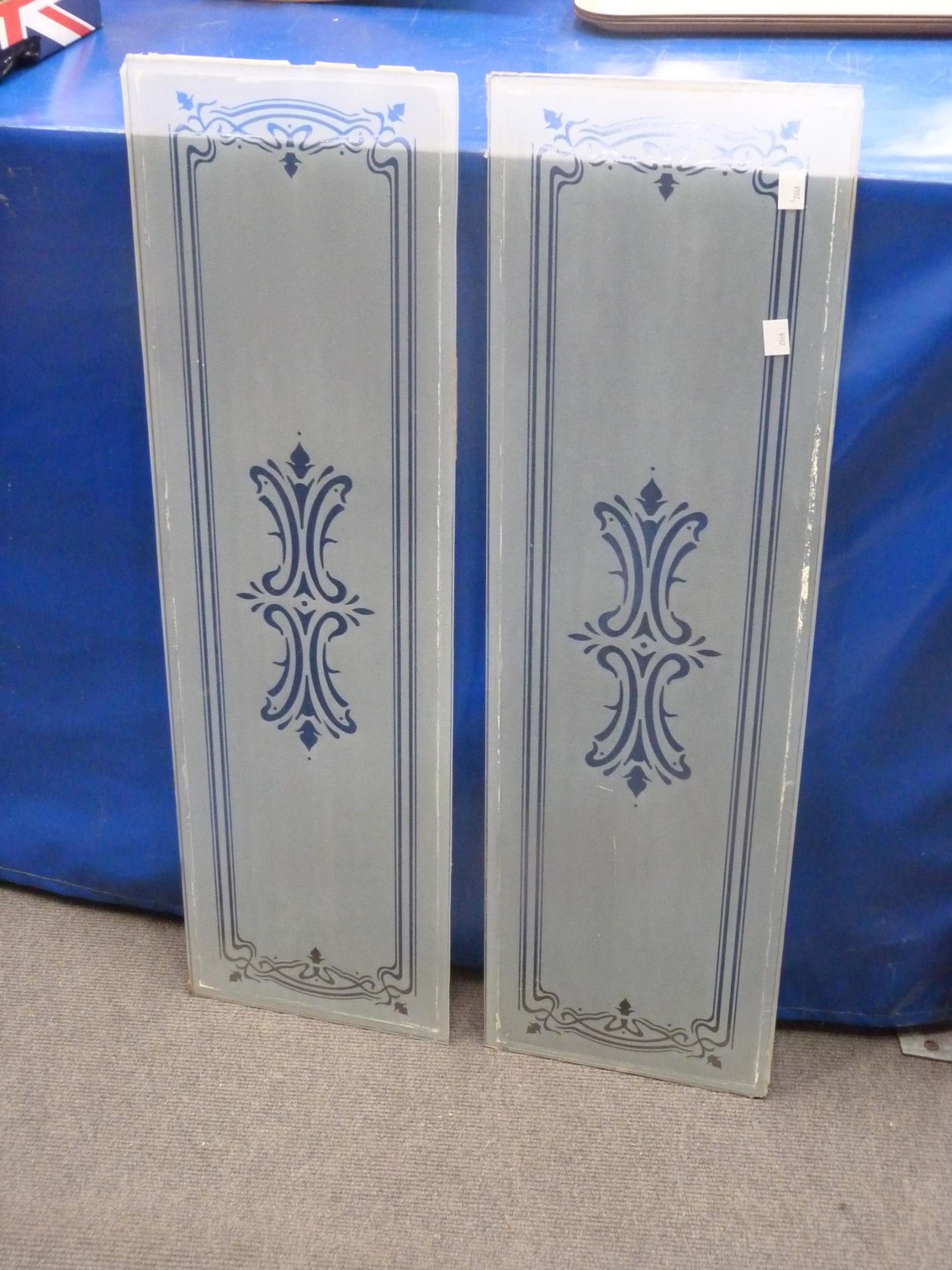 Eleven panels of door glass with two panels 'etched' (102cm x 31cm), two panels shaped with