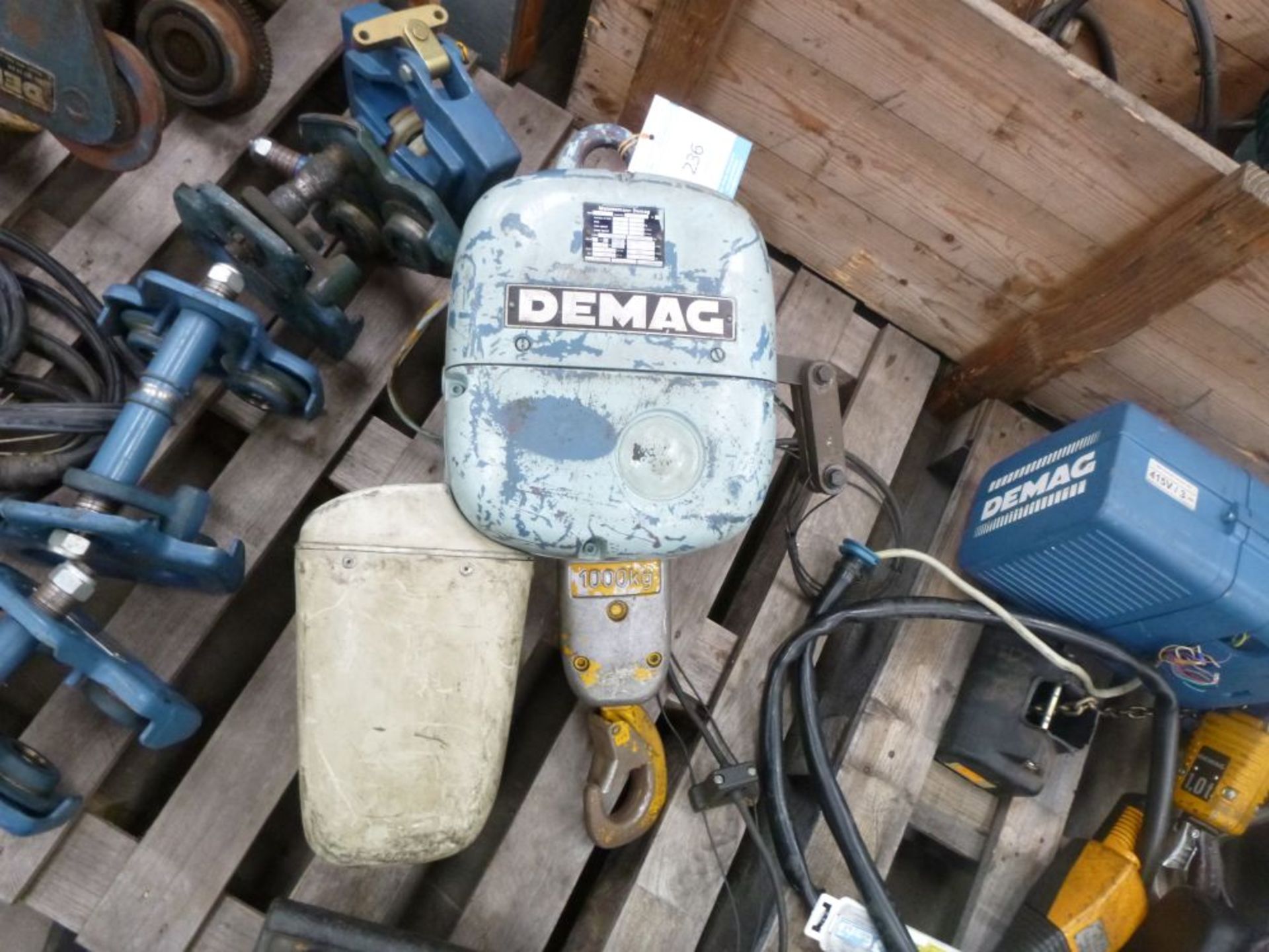 * A Demag Electric Hoist, SWL 1000kg. Please note there is a £10 +VAT lift out fee on this lot.