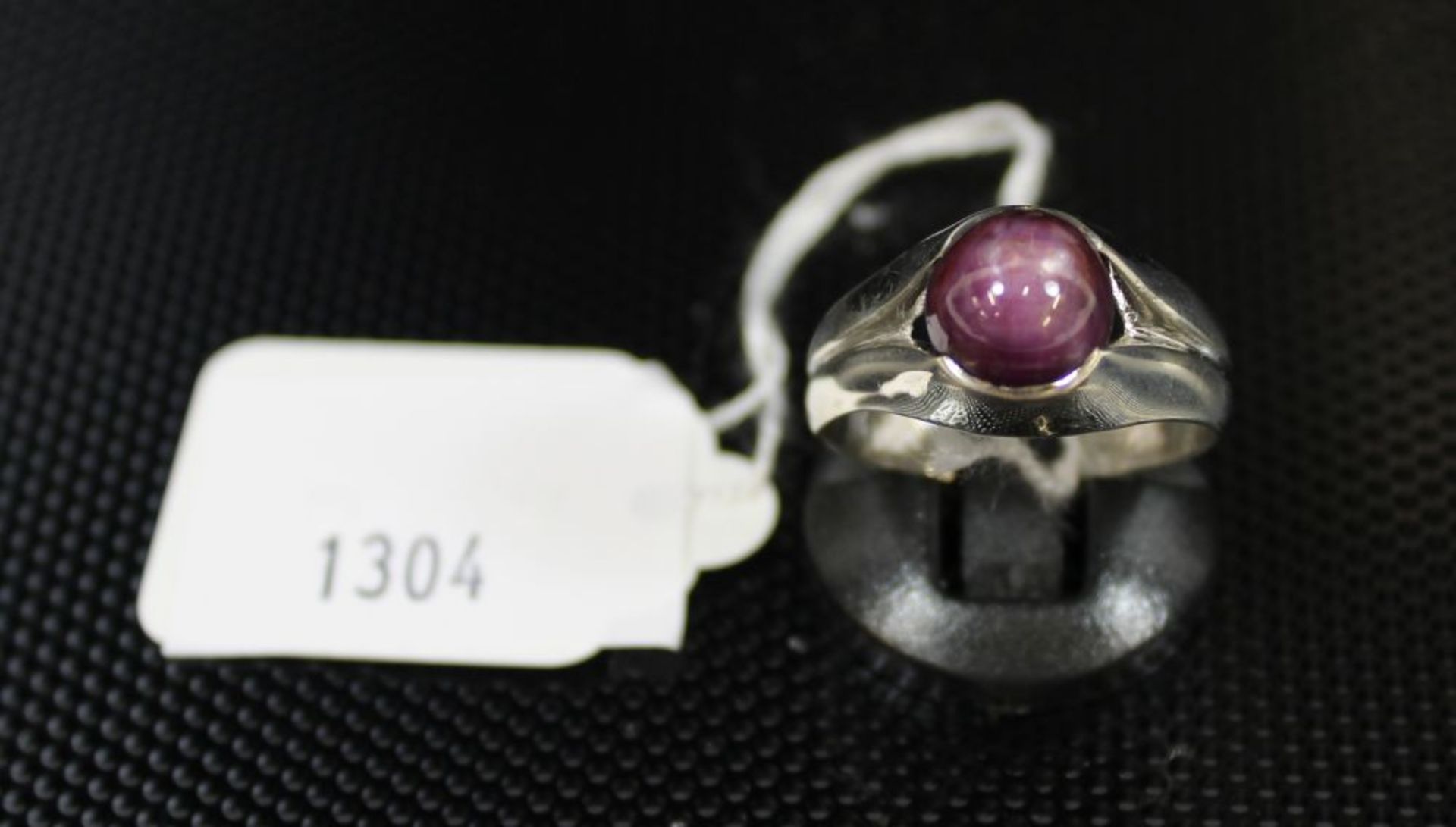 Star Ruby in white metal Ring shank (Size X) (est. £30-£50)