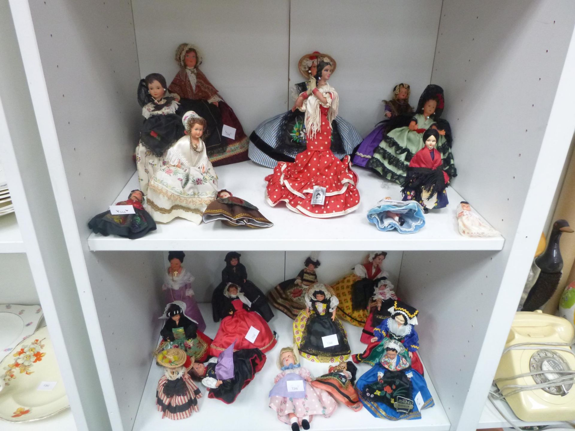 2 x Shelves to contain an assortment of Dolls, from France,Spain,Italy,etc (est. £20-£40)