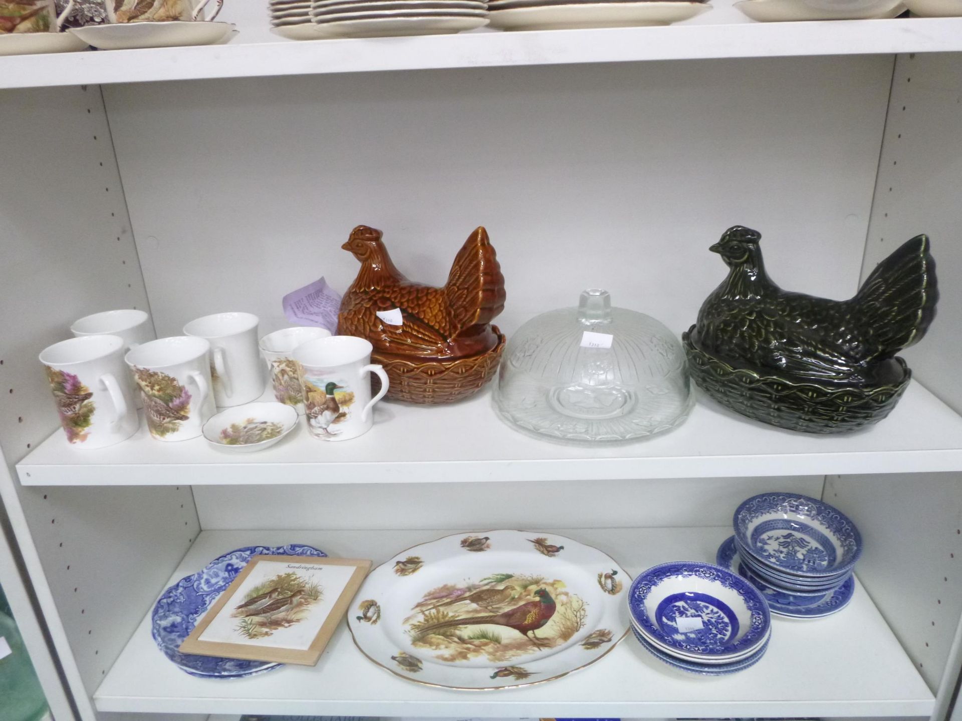 2 x Shelves of ceramics to include 2 Portmeiron Pottery Nesting Hens, Glass Cake Plate and Cover,