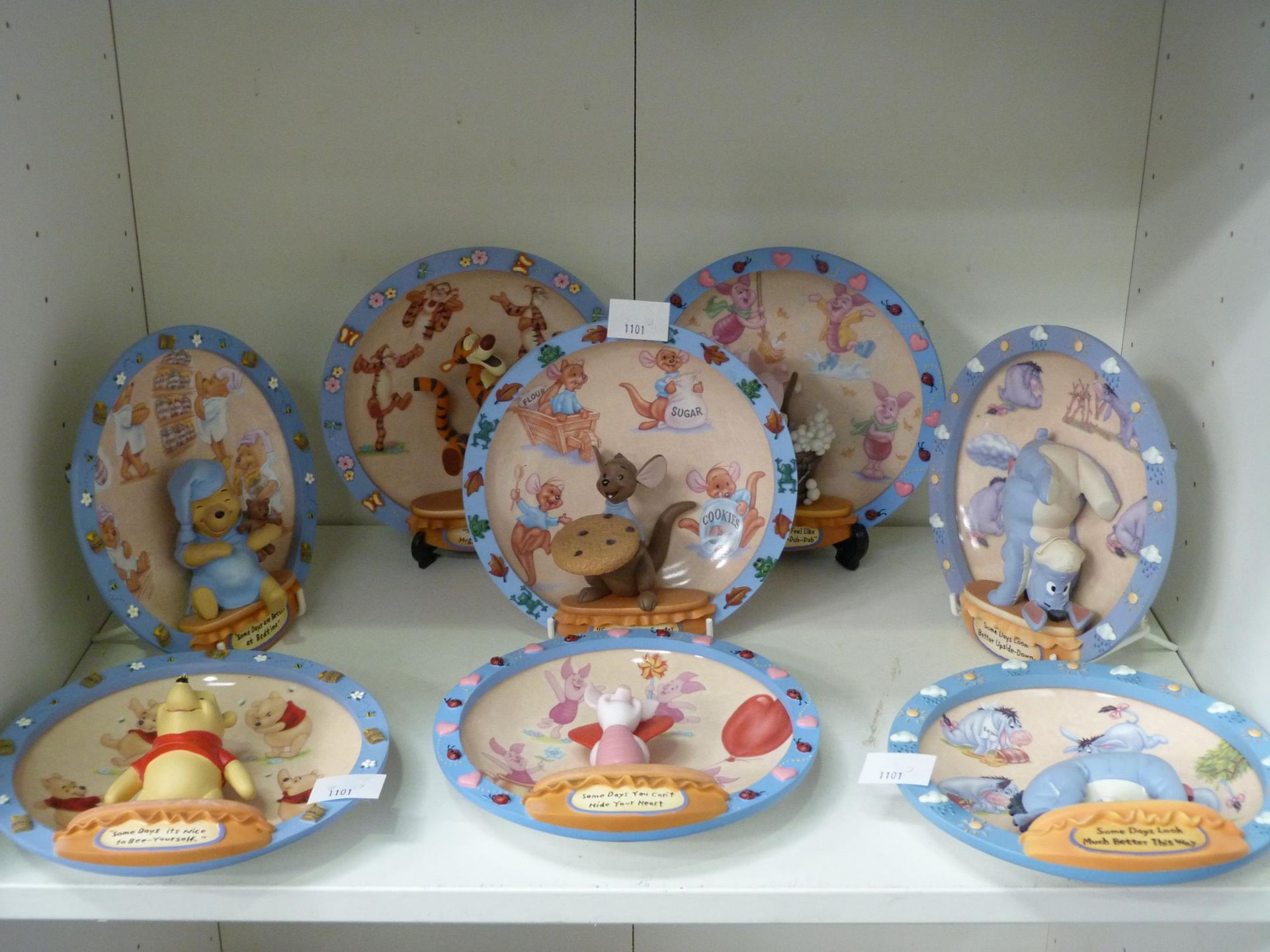 Two shelves to contain fourteen '100 Acres Days' Wall Hanging Display Plates of 'Winnie the Pooh'