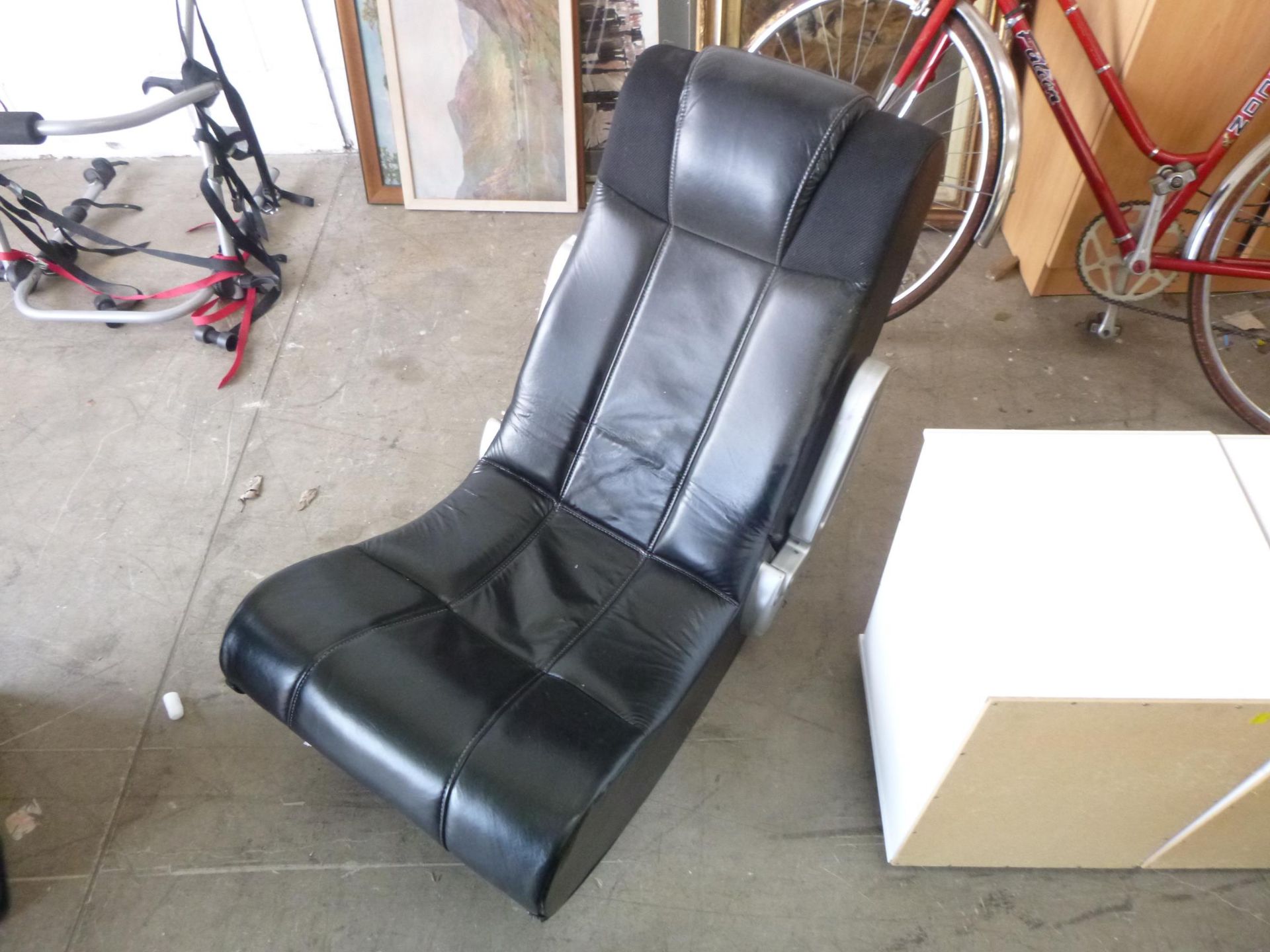 A black and silver Media Leather Chair (est.£20-£40)