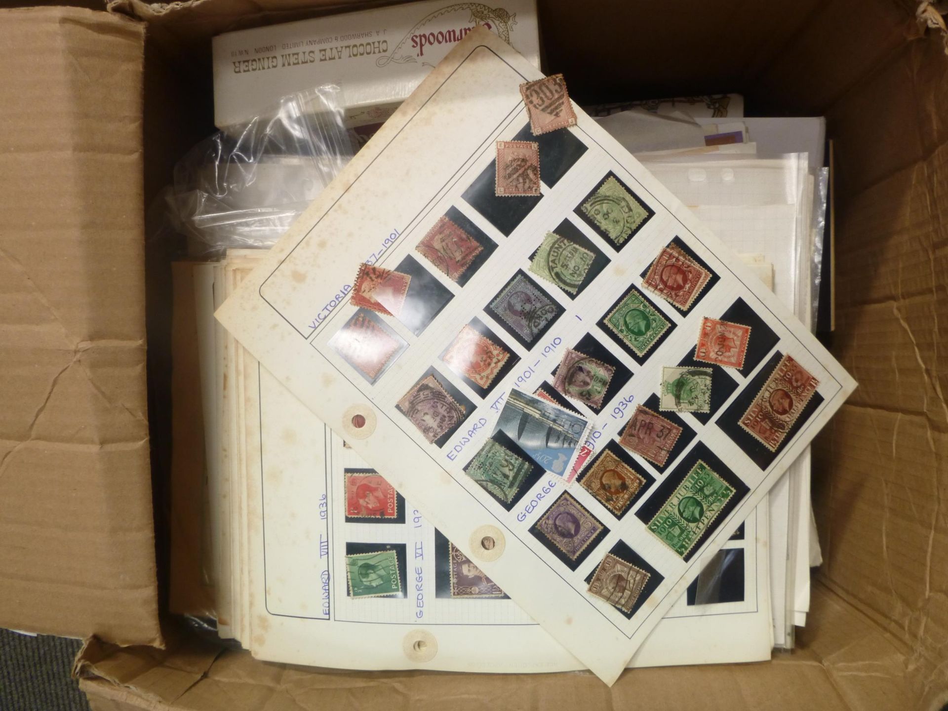 A Box of GB and World Stamps on album pages, stock pages and boxes together with a qty of First