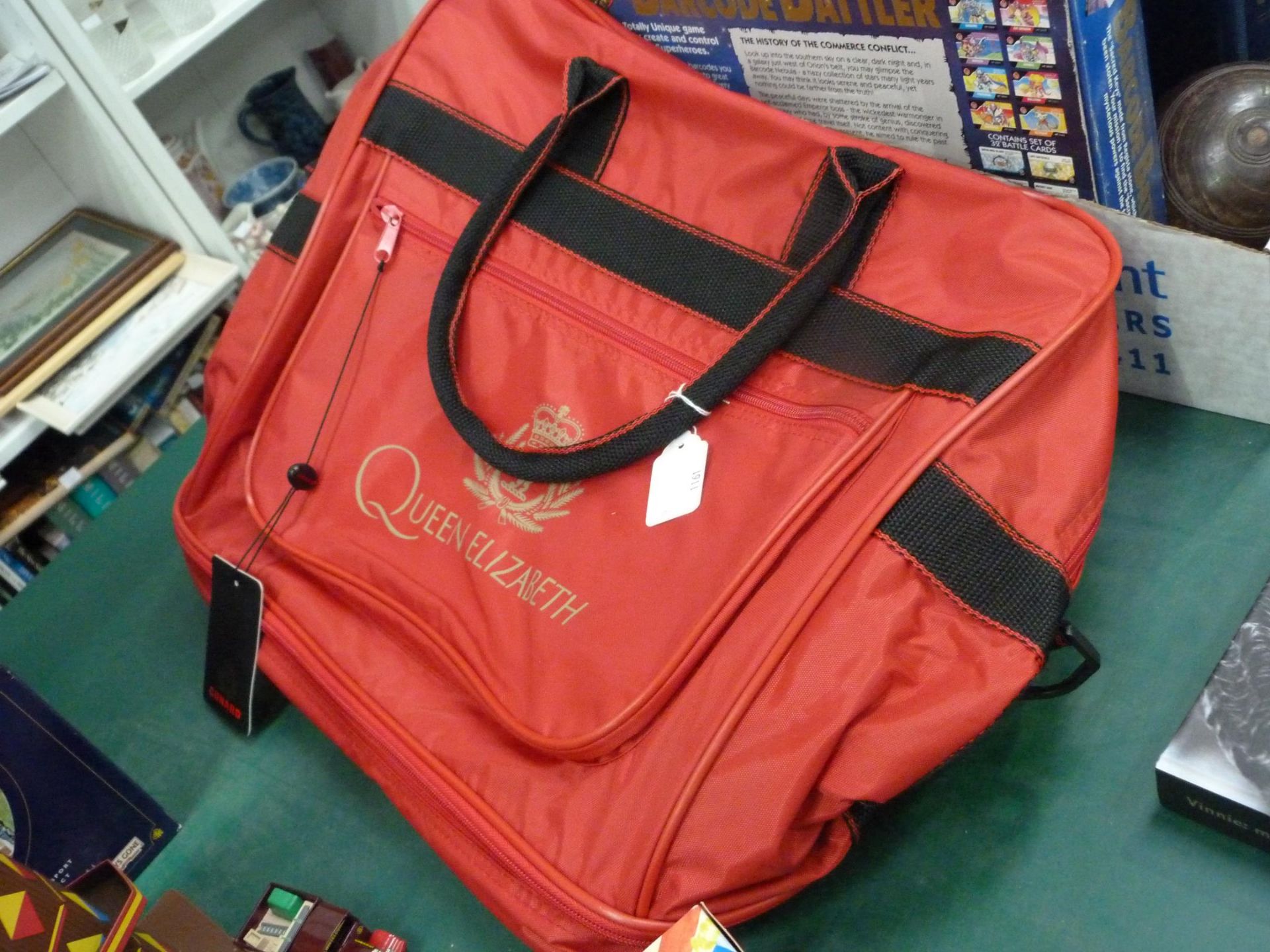 An assortment of items to include a signed Vinnie Jones Autobiography, a Cunard Queen Elizabeth Bag, - Image 8 of 8
