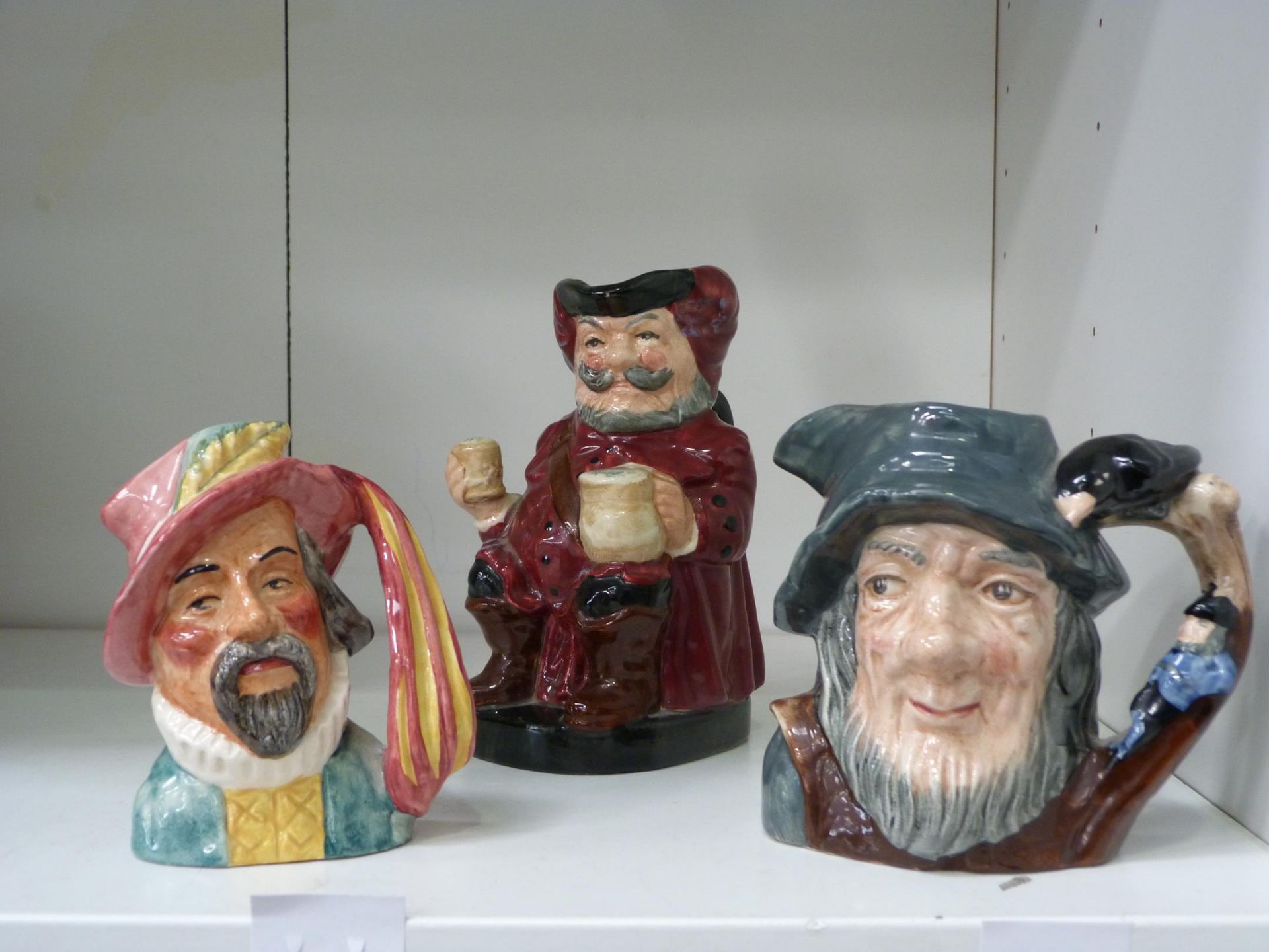 Three Figurines to include a Royal Doulton 'Falstaff' Toby Jug (8328A), a 'RIP Van Winkle' Toby