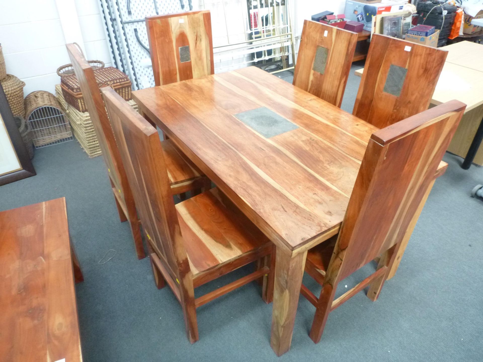 A Large Solid Wooden Dining Table with 6 Chairs. The table and back of each chair have a rectangular