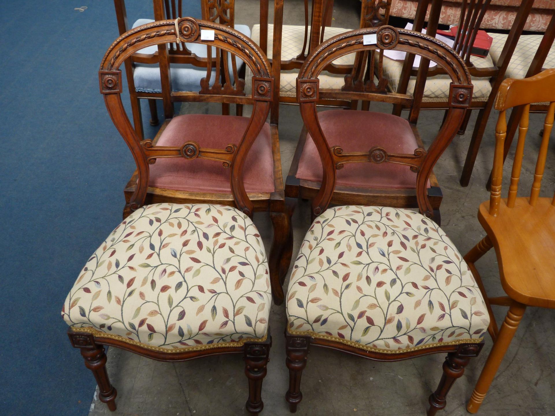 A pair of leaf upholstered Dining Chairs accompanied by a pair of single pink upholstered Chairs (4)