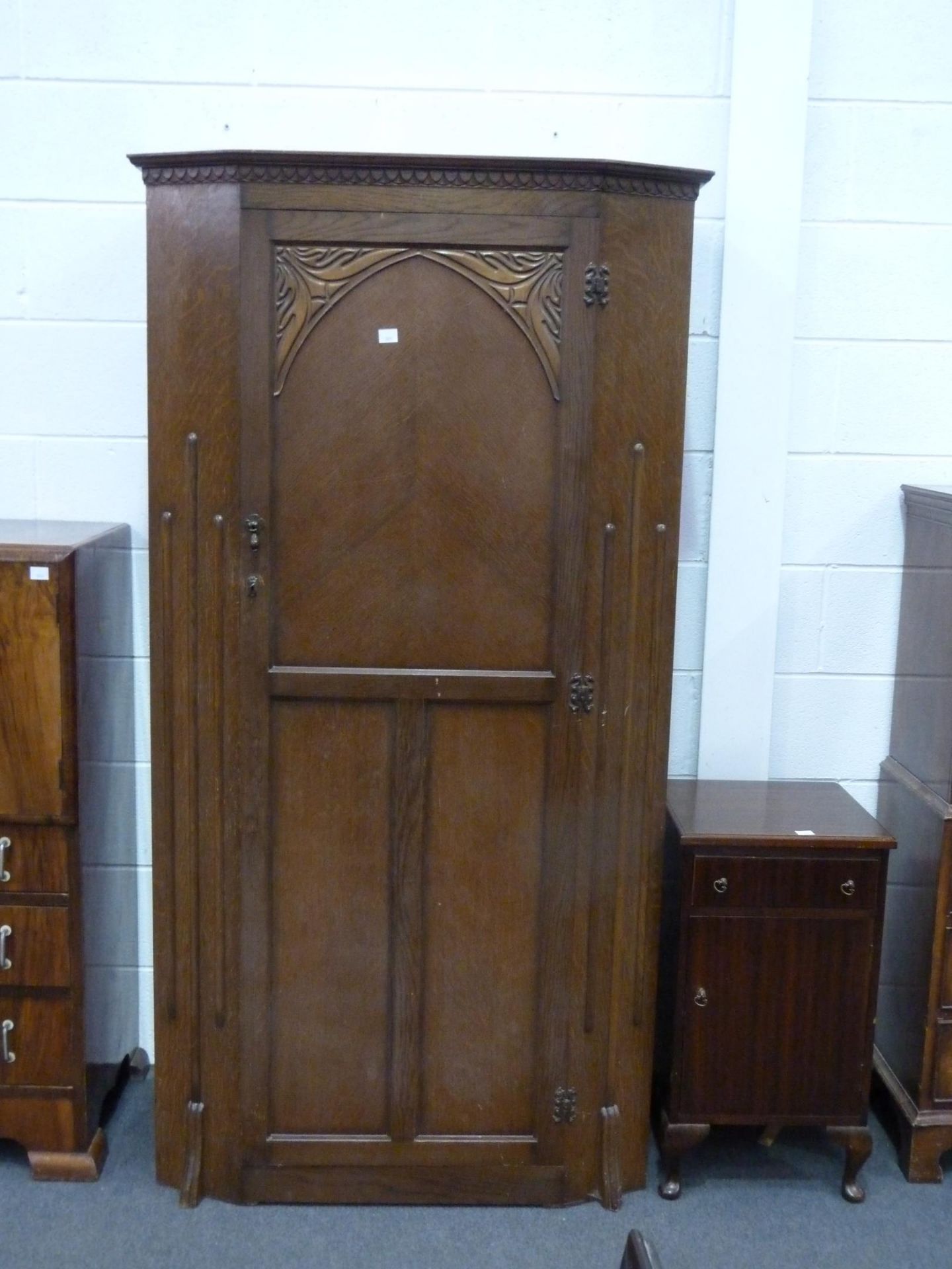 An Oak Hall Robe with Carved and Panelled single door 98cms together with a Mahogany Bedside Cabinet