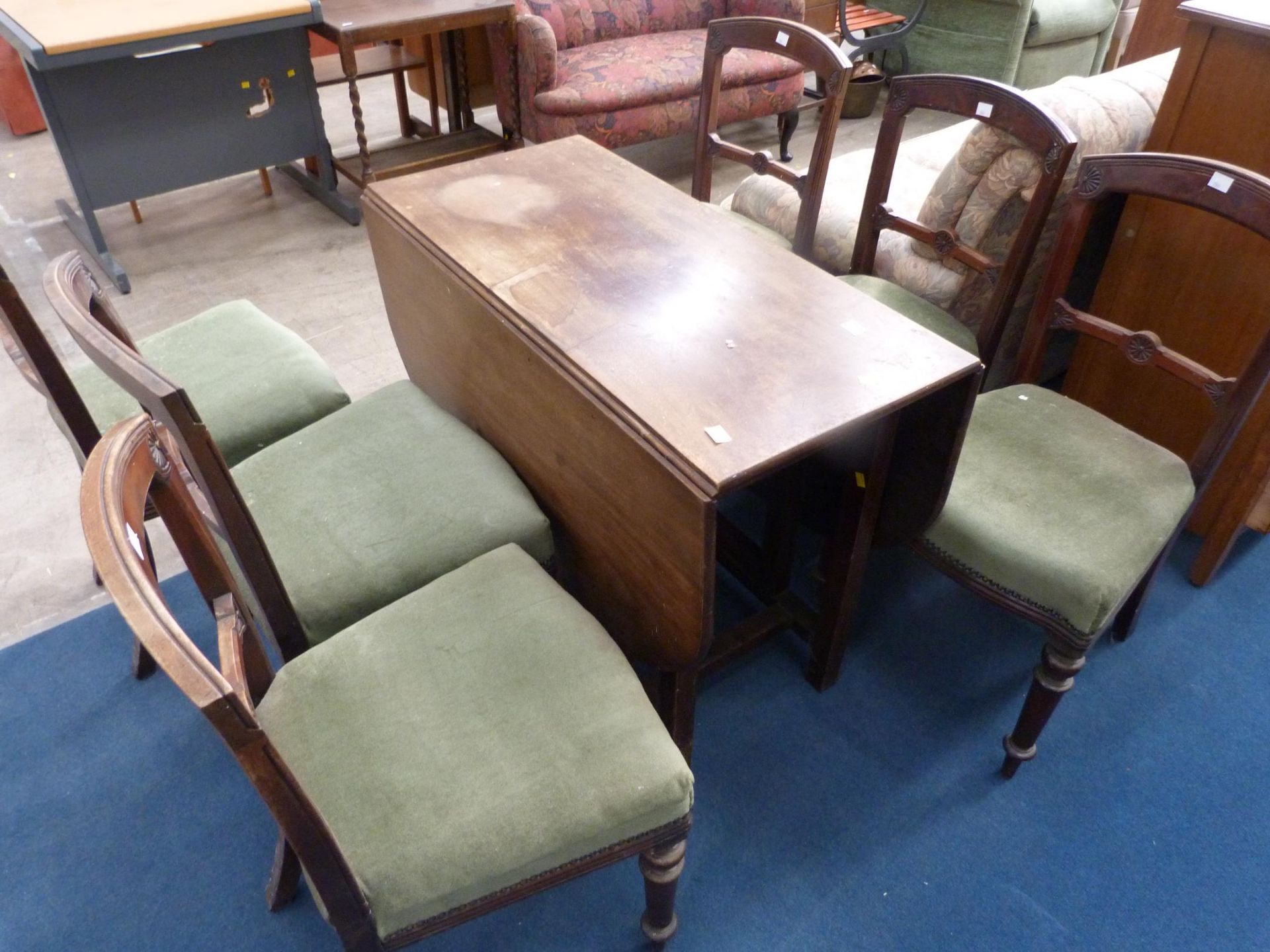 A Drop Leaf Gate Leg Dining Table (H76cm, W98.5cm, D48cm (Closed) 144cm (Open)) together with Six