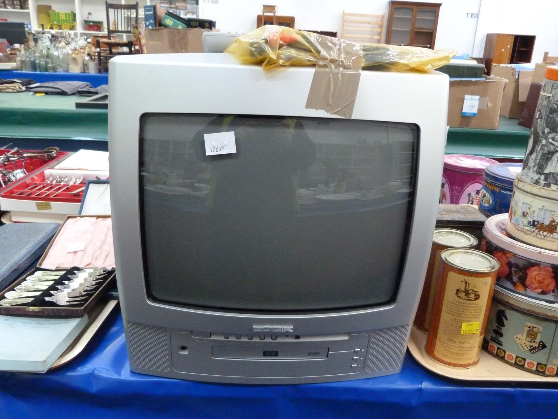 A Logic Colour Television Model L14TD100 in working Order- with remote (est £20-£40)