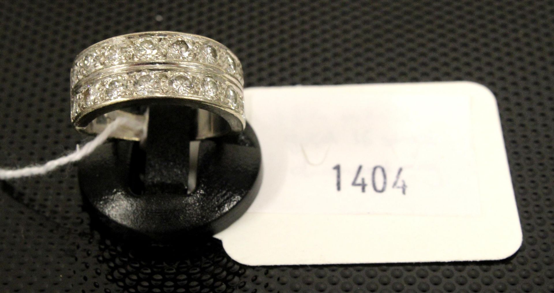 An impressive 18ct White Gold 16 stone Diamond ring size M, boxed. (Est. £500 - £800)