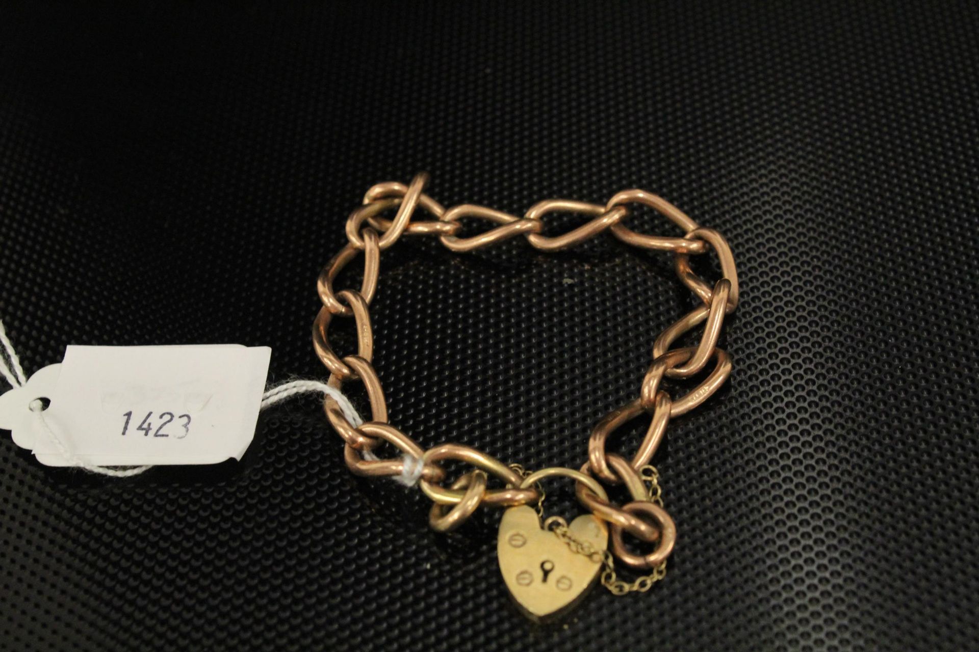 A 9ct Gold Broad Link Chain Bracelet 27gms. (Est. £200 - £400)