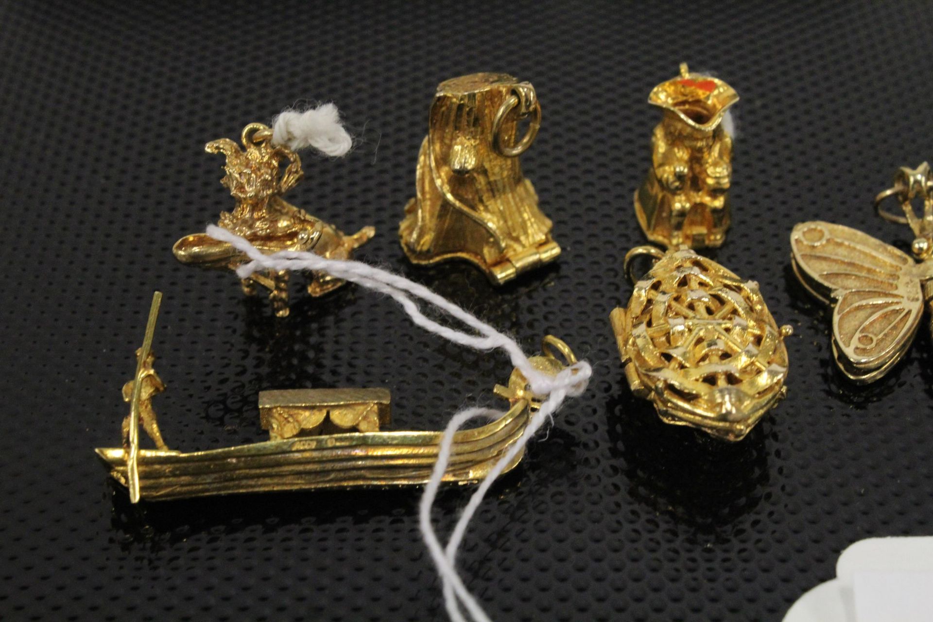 A collection of Six 9ct Gold Charms 27gms & another similar unmarked (7) (Est. £250 - £350) - Image 2 of 4