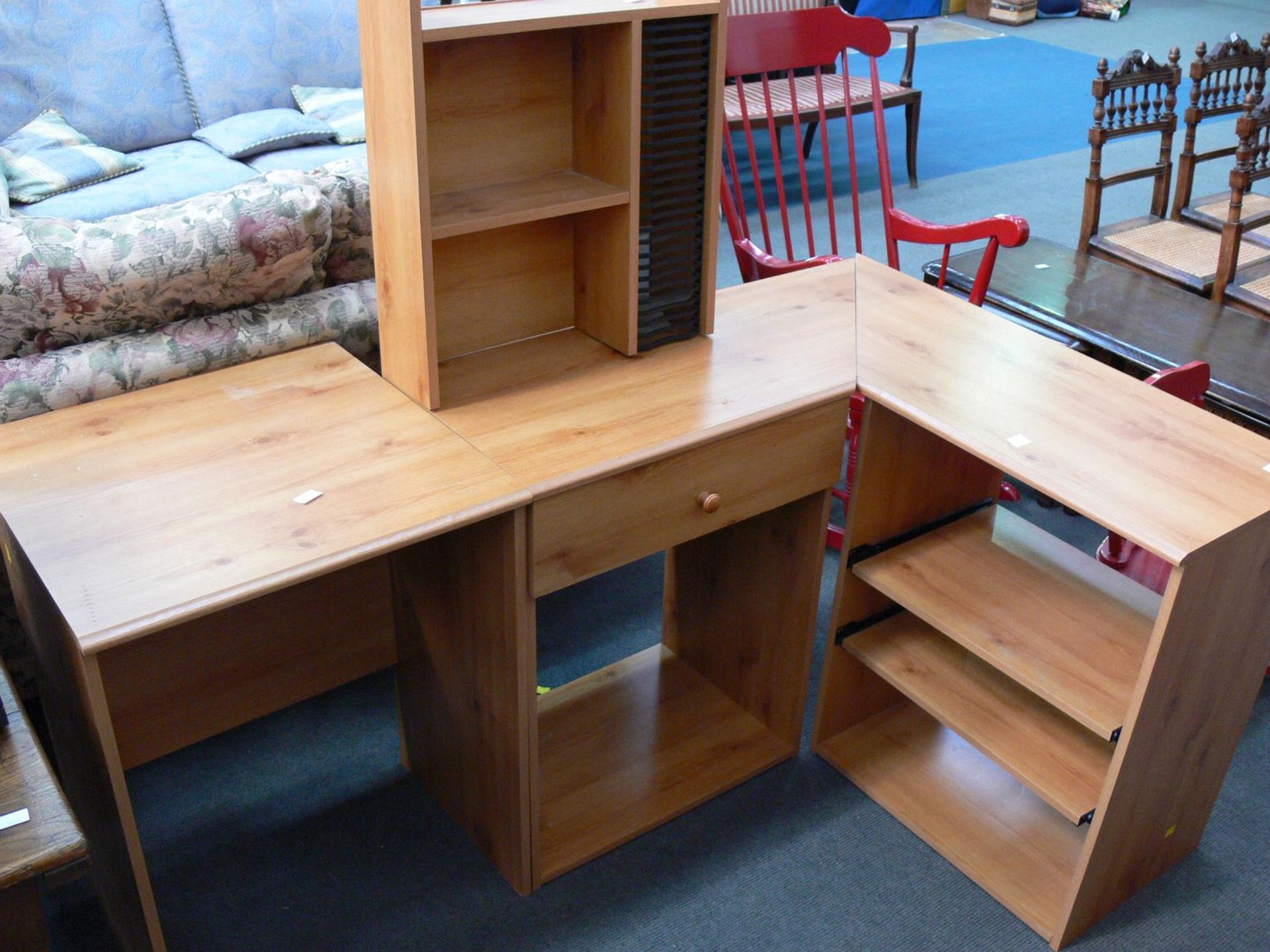 A modern laminated computer station in pine finish to include an ''L'' shaped Desk with drawer,