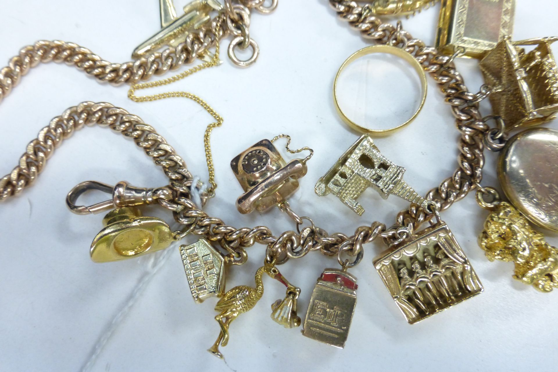 A 9ct Gold Watch Albert/Charm Bracelet Set with eighteen mostly 9ct charms (not all hallmarked) - Image 2 of 3