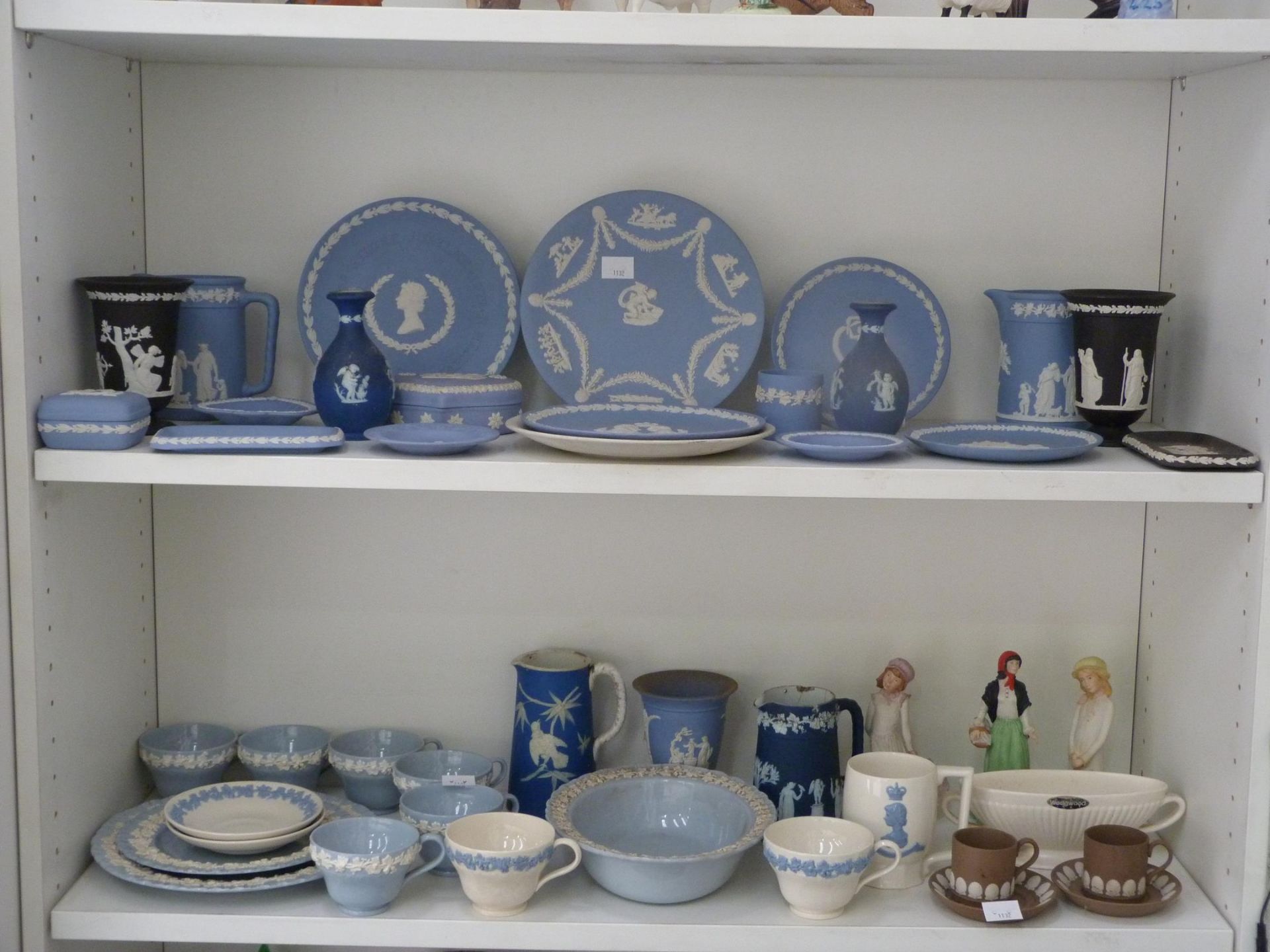 Two shelves to contain an assortment of Wedgwood, including two young girl figurines, 'Ireland' lady