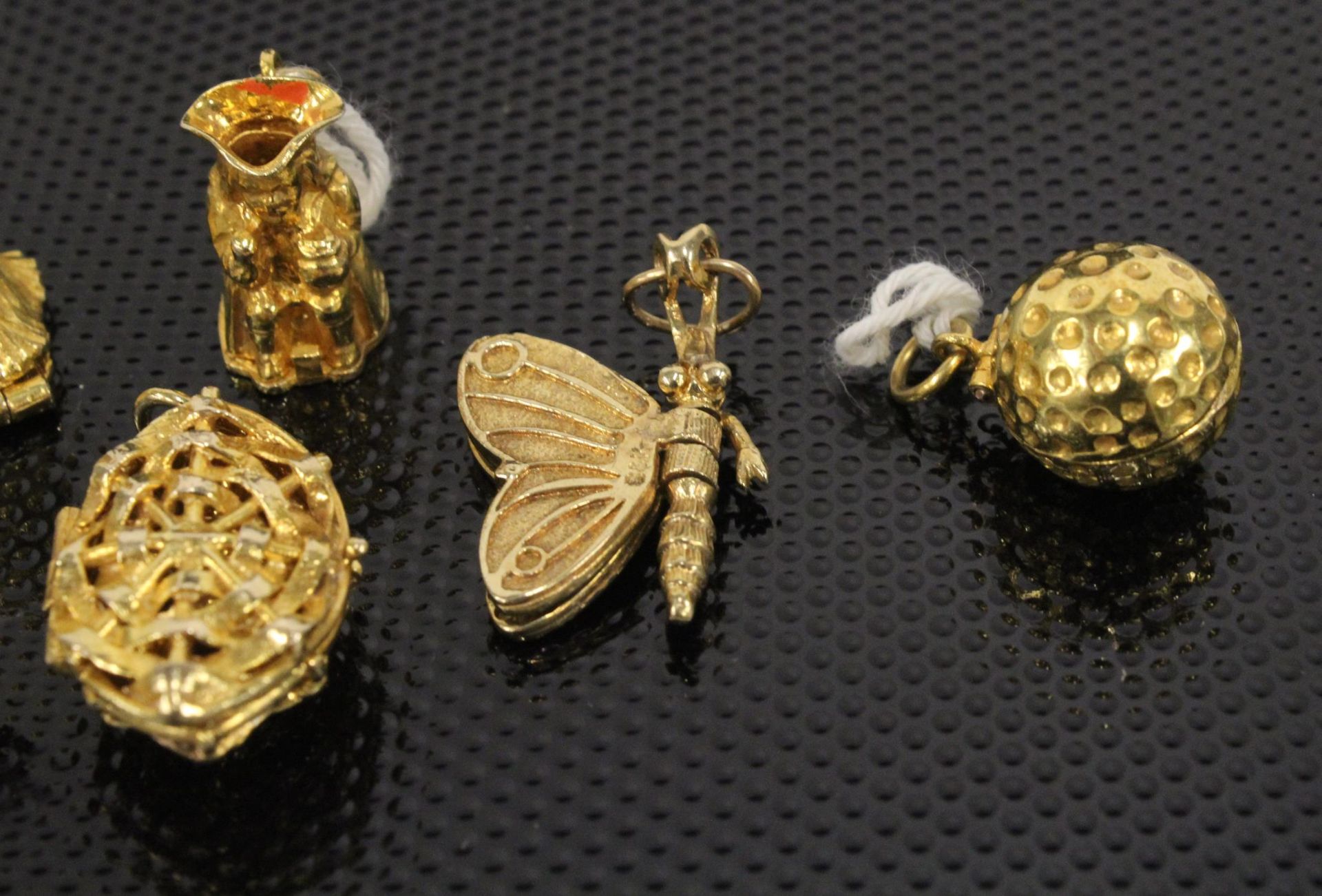 A collection of Six 9ct Gold Charms 27gms & another similar unmarked (7) (Est. £250 - £350) - Image 3 of 4