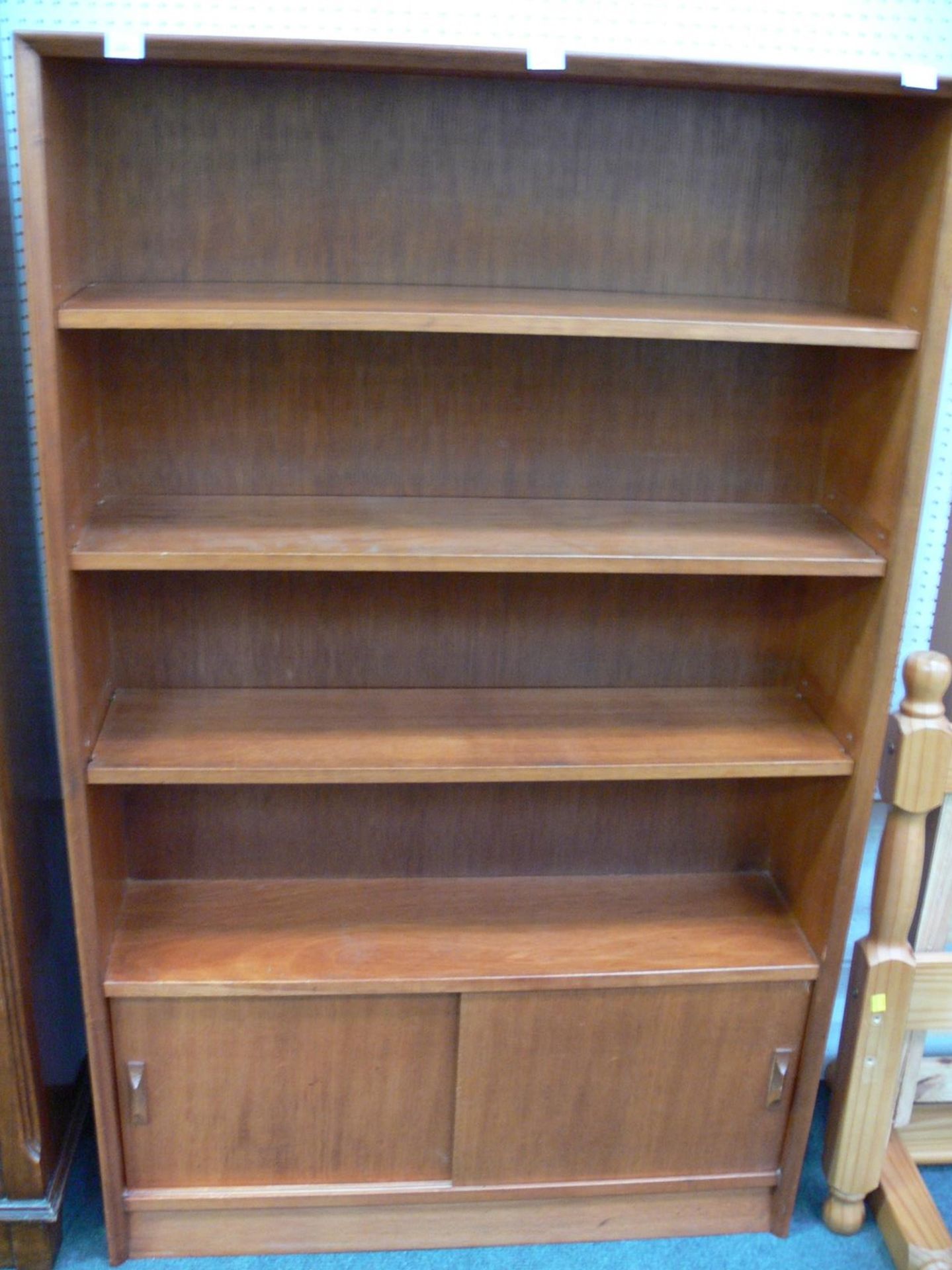 An open Bookcase with 3 adjustable shelves with cupboard below with sliding doors (H147.5cm W91cm