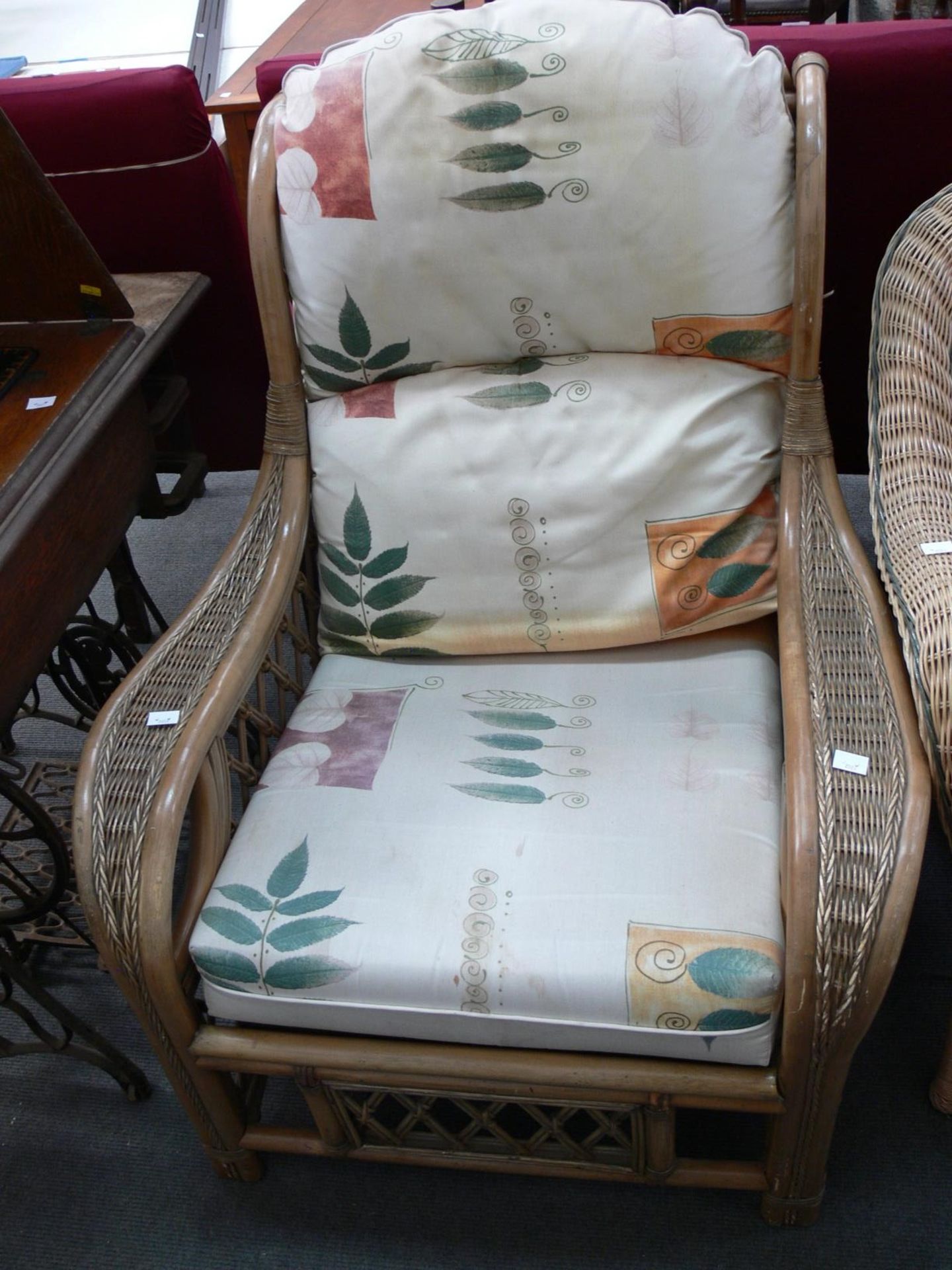 A Cane single seat Conservatory Chair with Cushions. (Est. £20 -£40)