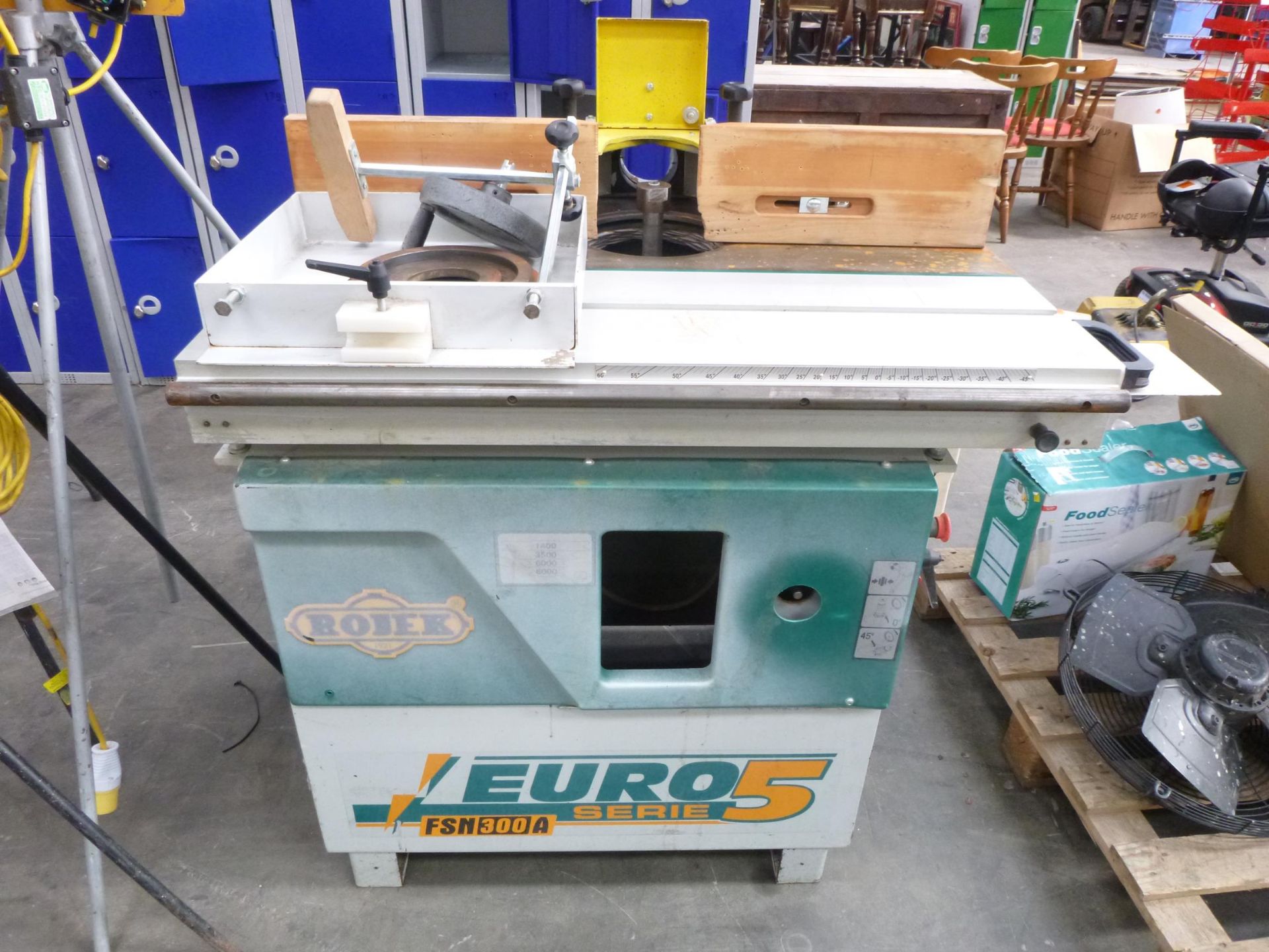 * A Rojex Euro FSN 300A Series 5, 4 Speed Tilting Head Spindle Mounder and Sliding Table.