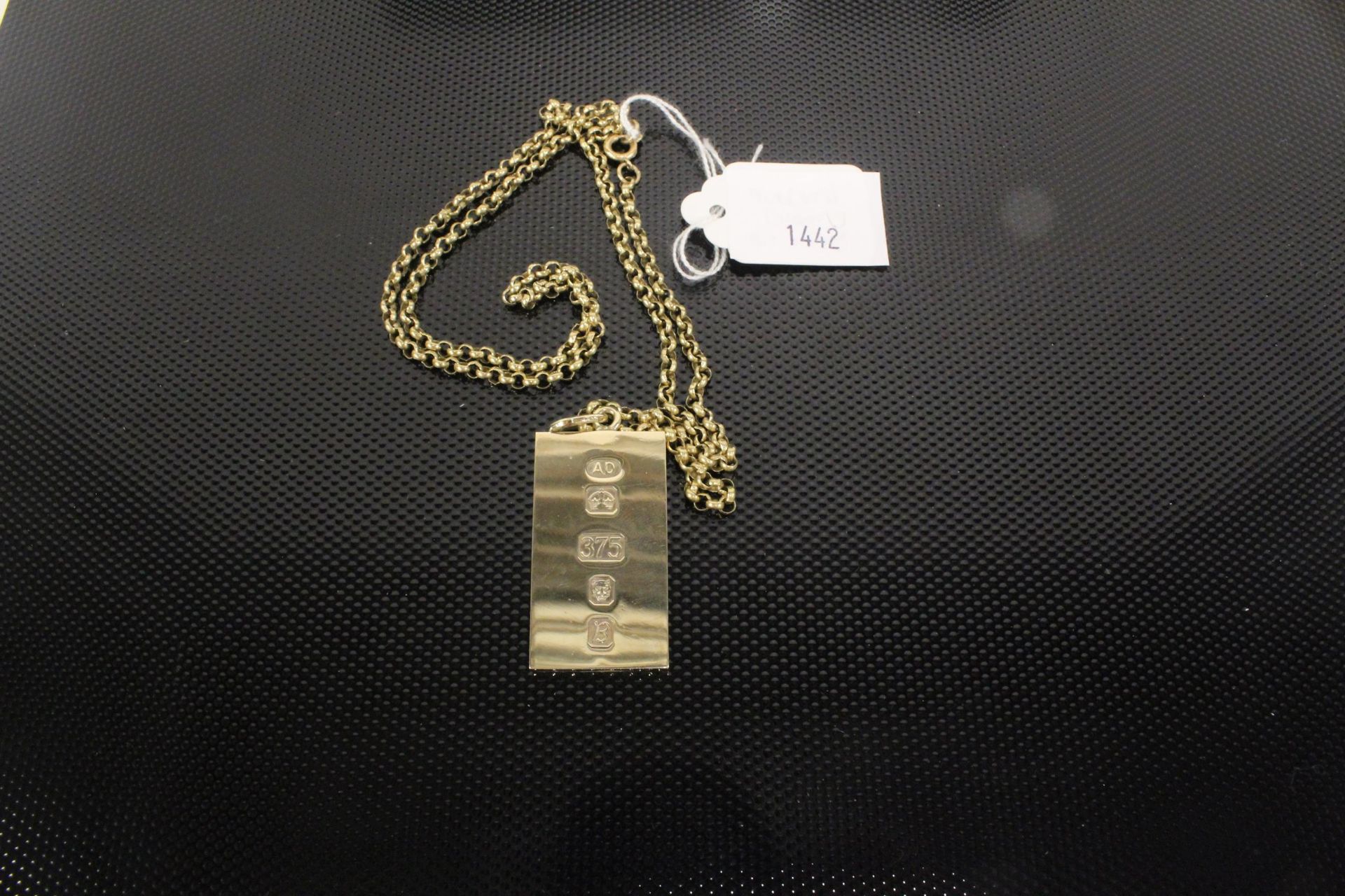 A 9ct Gold Ingot Pendant on a 9ct Gold Chain 42gms.(Est. £350 - £450)