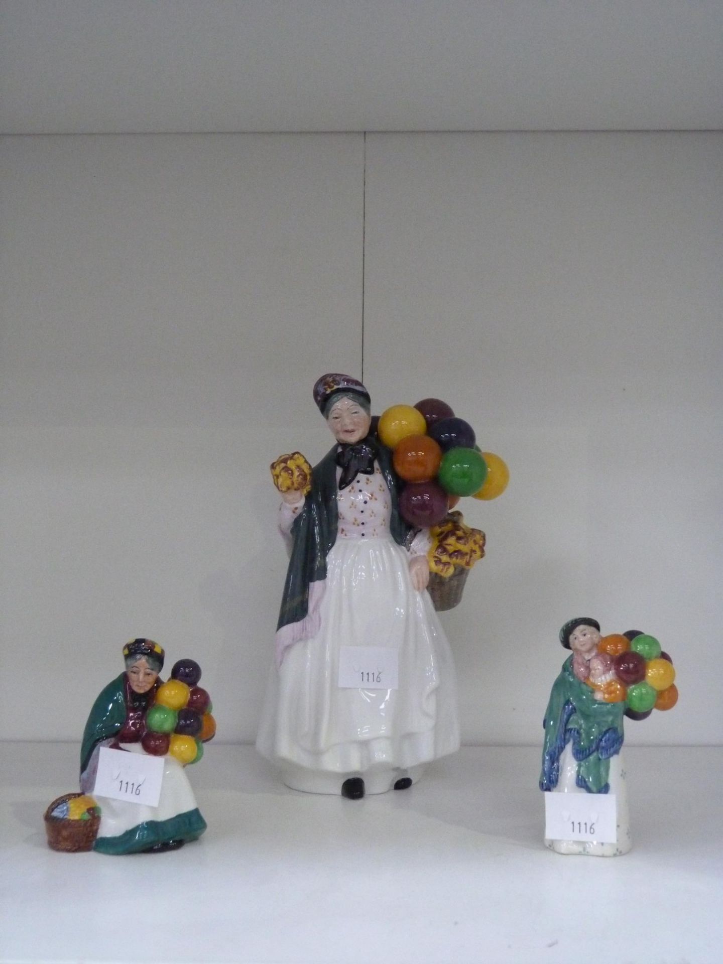 Three Royal Doulton Balloon Seller Figurines to include 'The Old Balloon Seller' and 'Biddy Penny