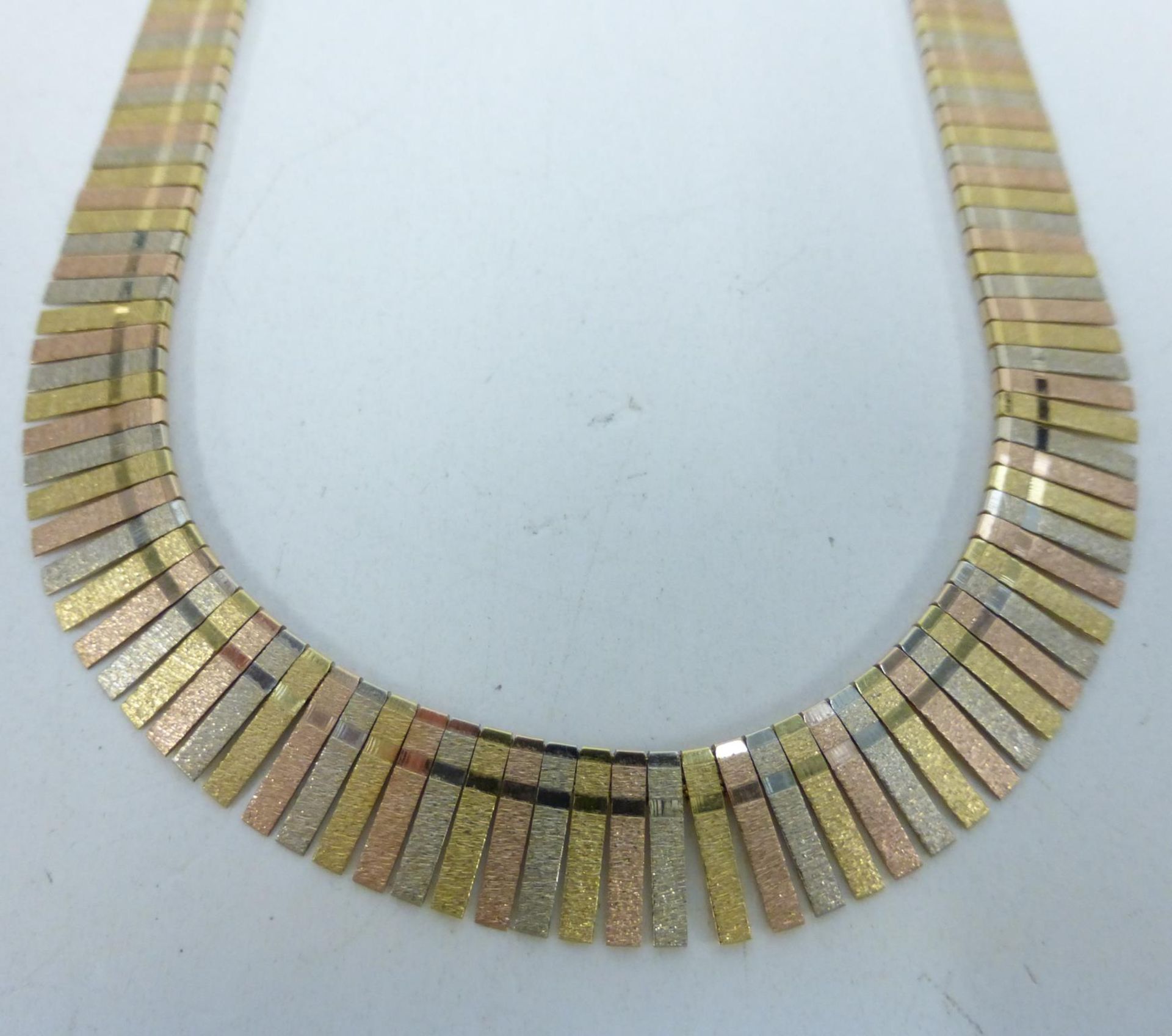 An 18ct Gold tapering with multicolour flexible band Necklet 35gms boxed. (est £700-£900) - Image 2 of 2