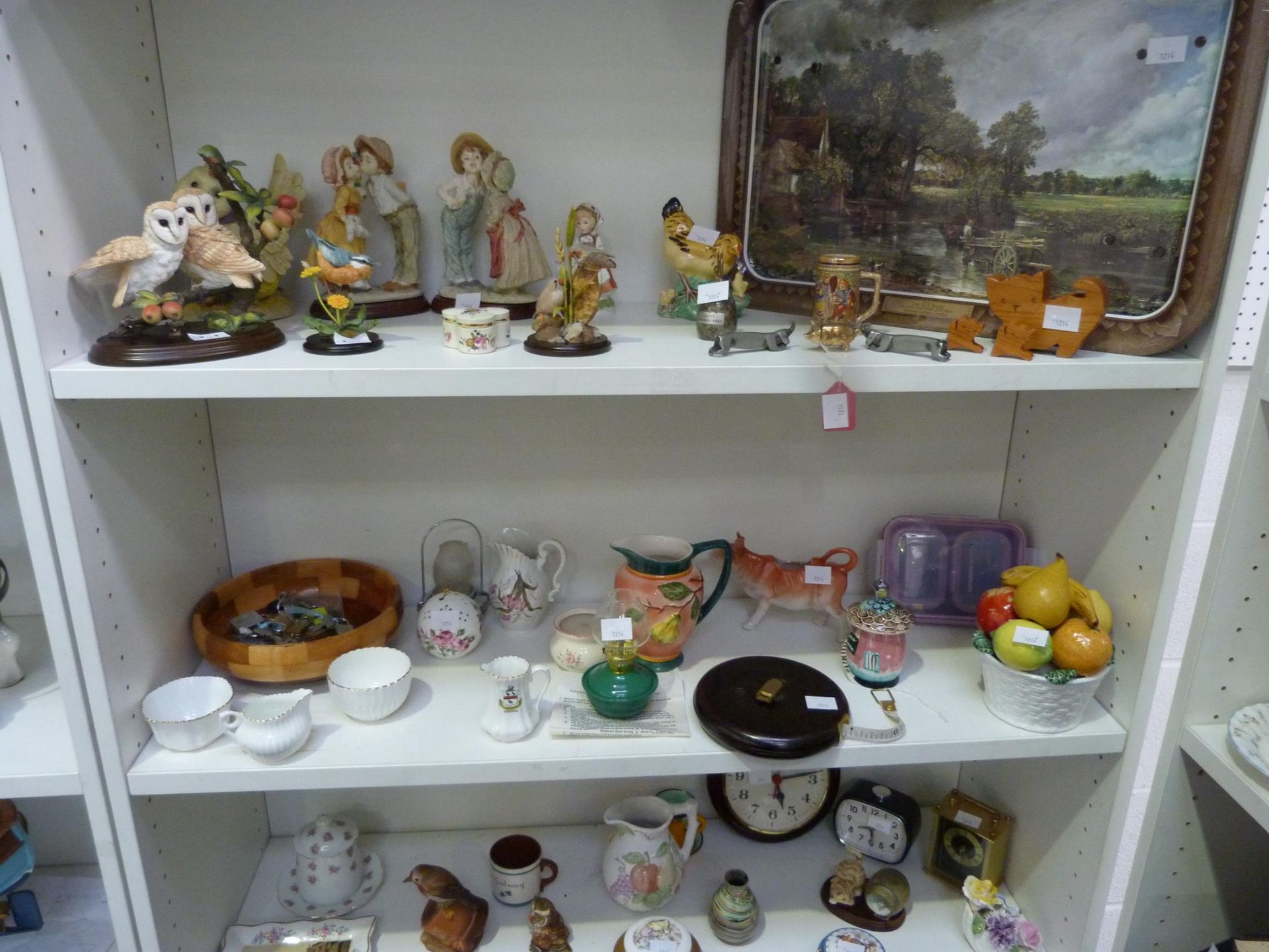 Three shelves of collectable items to include:- Metal Tea Tray Depicting Constable's 'The Hay Wain',