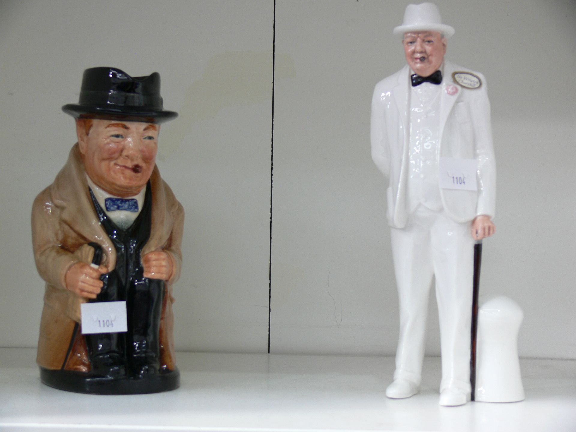 A Royal Doulton 'Sir Winston Churchill' - HN3057 Figurine accompanied by a Royal Doulton 'Winston