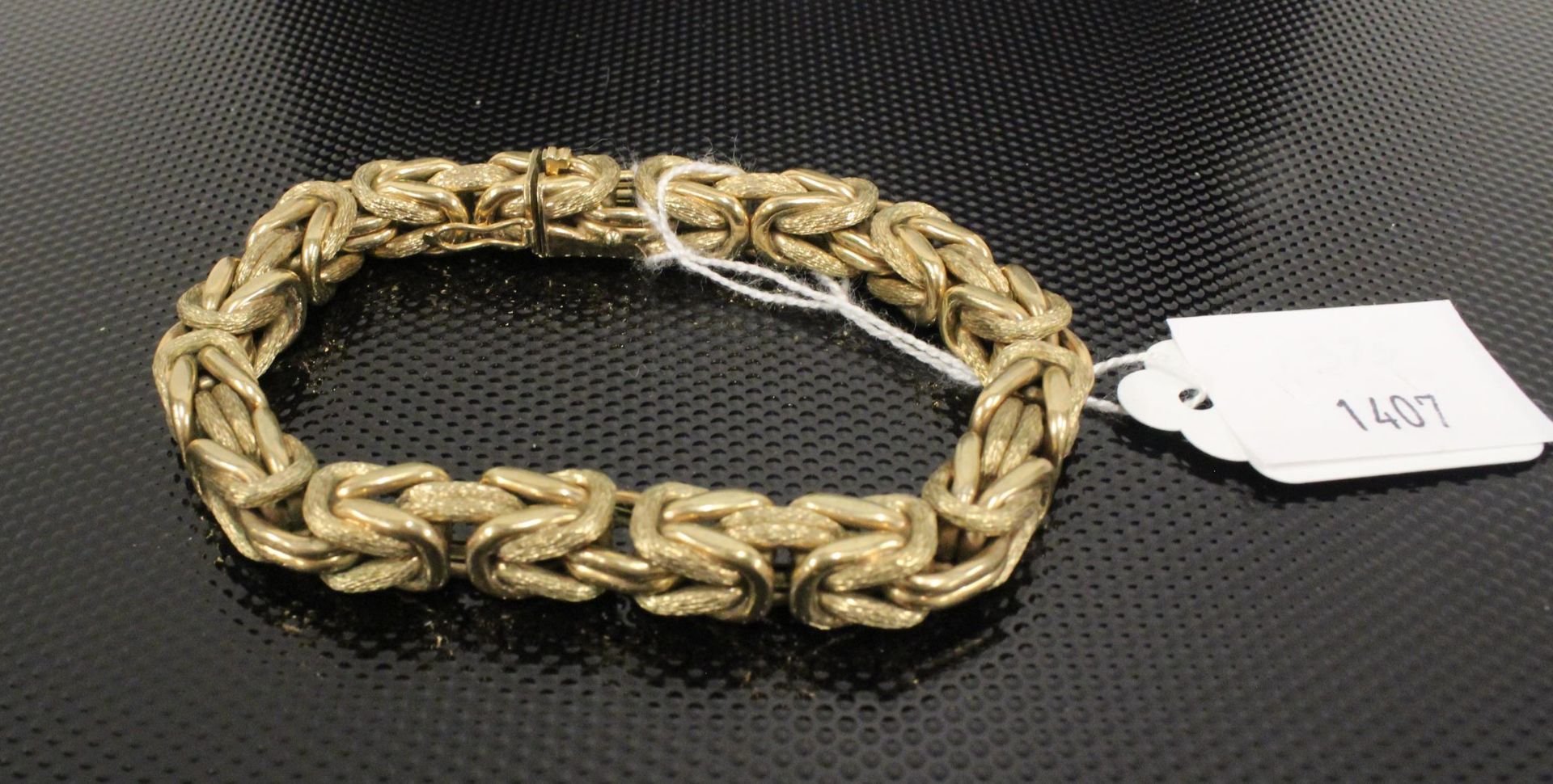 A 9ct Gold large fancy link Bracelet. 35gms, cased. (Est. £300-£500)