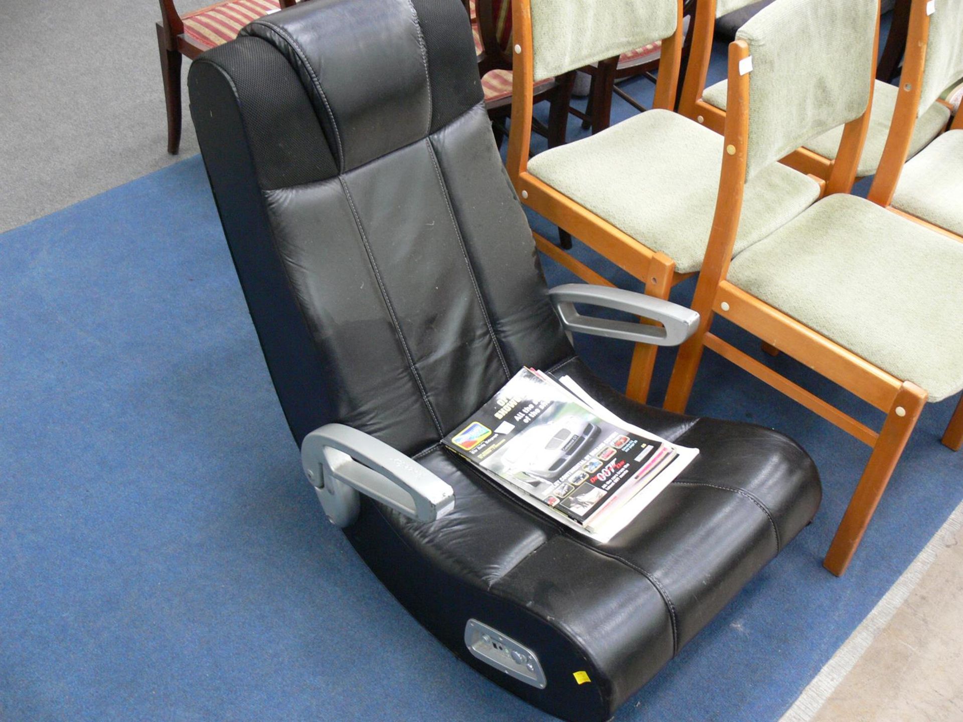 A black and silver Media Leather Chair together with 3 Motor Show Reviews 1988,1996, 2002 and Jaguar
