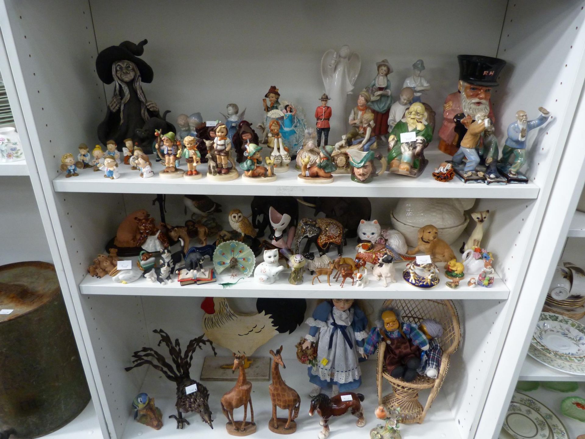 Three shelves to include a selection of Human and Animal Figurines such as five Goebel Children
