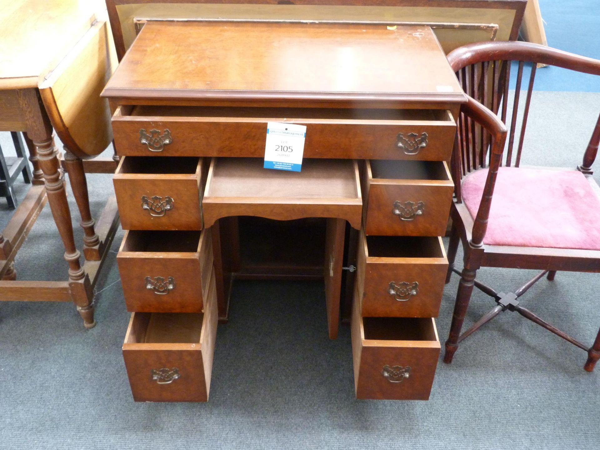 A Georgian Style Walnut Lowboy with frieze drawers, central recessed cupboard and three drawers at - Image 2 of 2