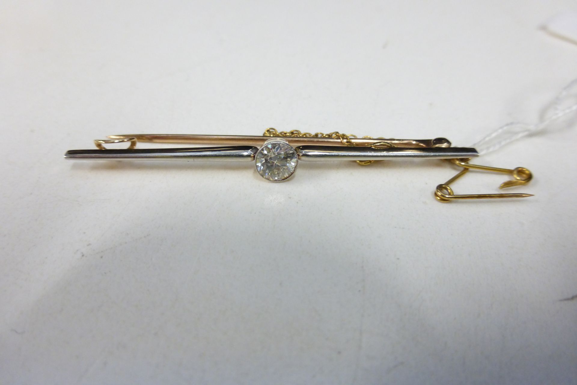 A 5/8 Carat Diamond on 15 Carat Gold Bar Brooch. (Est. £500 - £600)