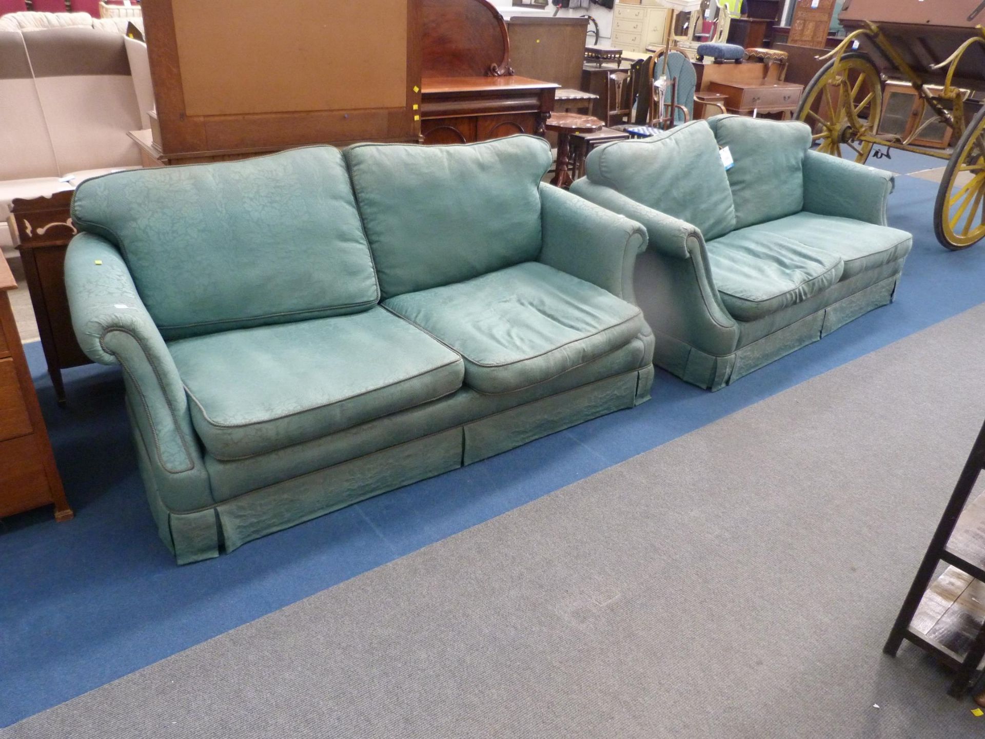 A Pair of Green Upholstered Three Seater Settees each with loose back seats Cushions. (Est. £30-£