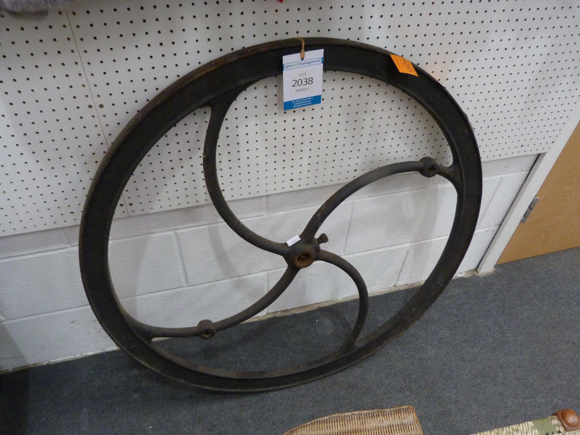 A Large Cast Iron Drive Wheel with centre locking bolt and two square handle holes - Diam 91cm