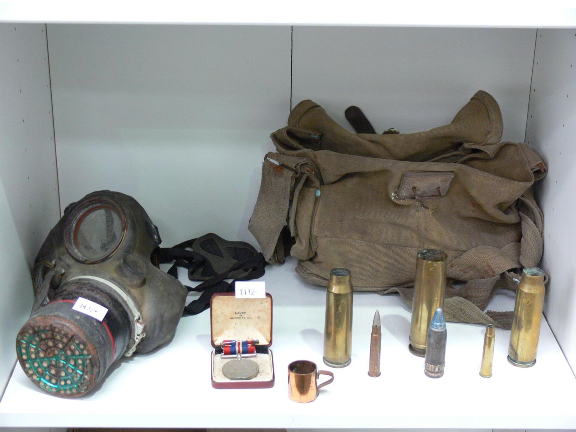 Four shelves to contain Military items to include an 'ARP' Helmet, Gas Mask, Goggles, Ammunition - Image 2 of 5