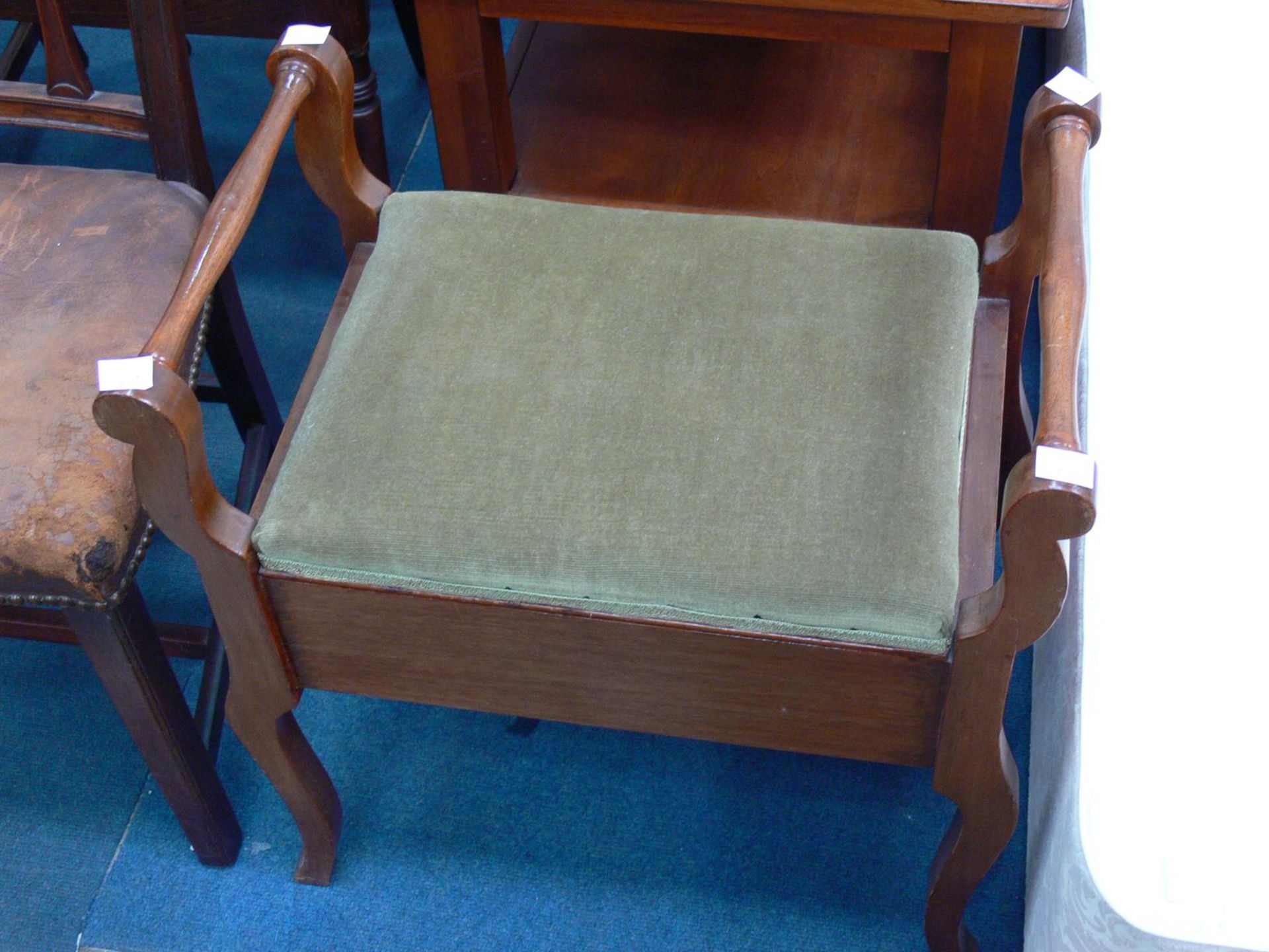 A wooden piano Stool with upholstered folding Seat. (H60cm W56cm D35cm ) (Est. £20 -£30)