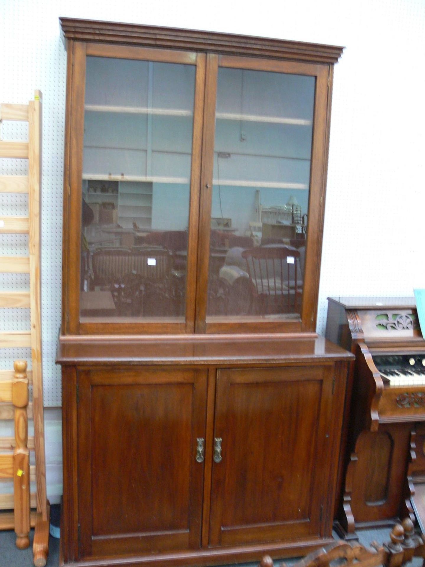 A Large Bookcase Bureau with 3 adjustable shelves behind plain glass doors (Lockable with key) (