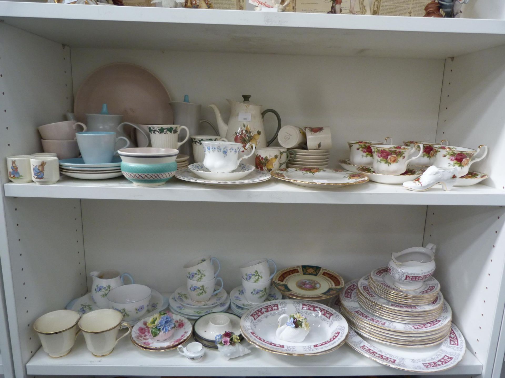 Two shelves to contain an assortment of ceramic tableware to include Poole, Shelley, Royal Albert '