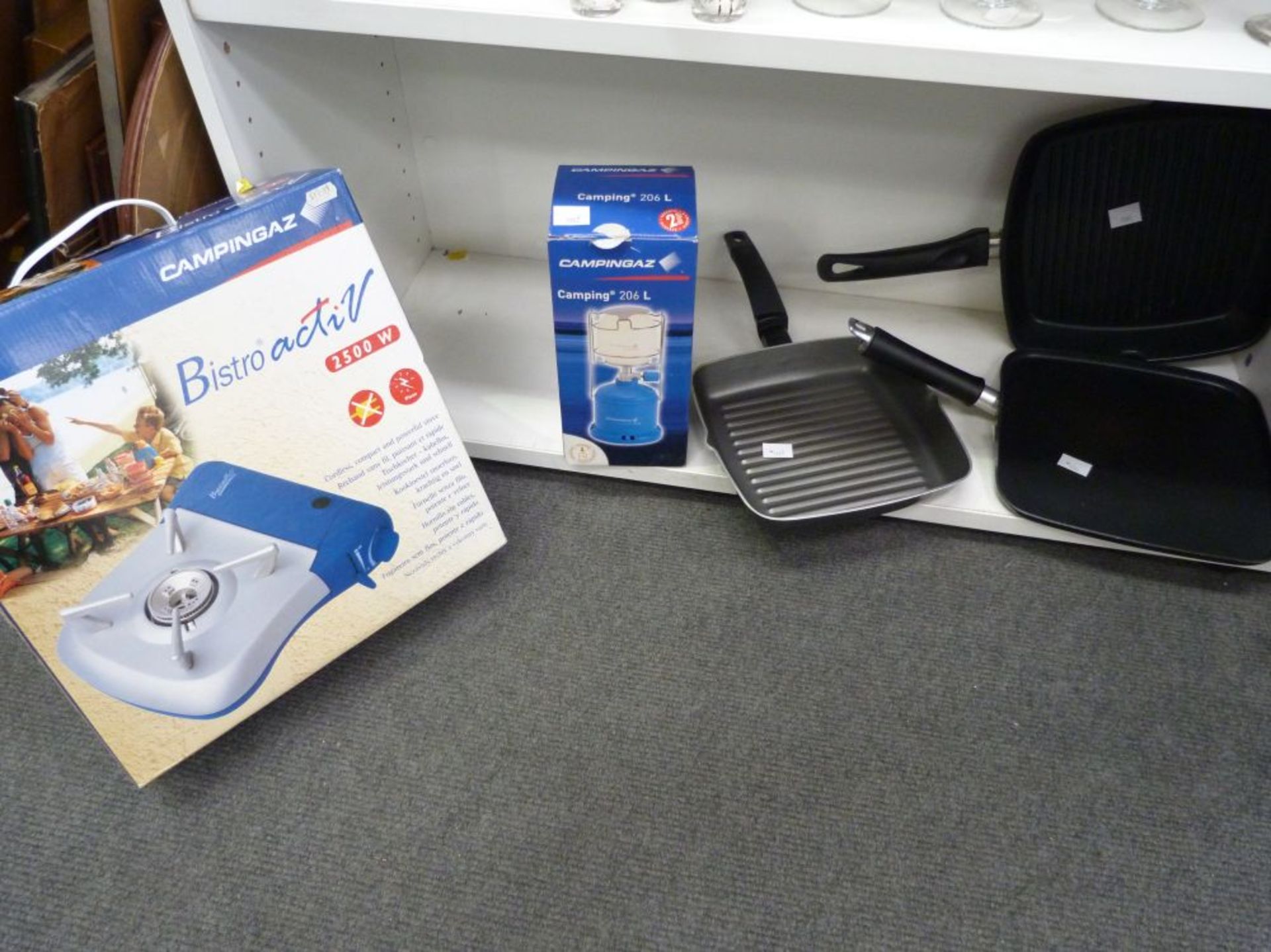 A Boxed Campingaz Bistro Activ 2500W together with a similarly boxed Camping Light 206L also