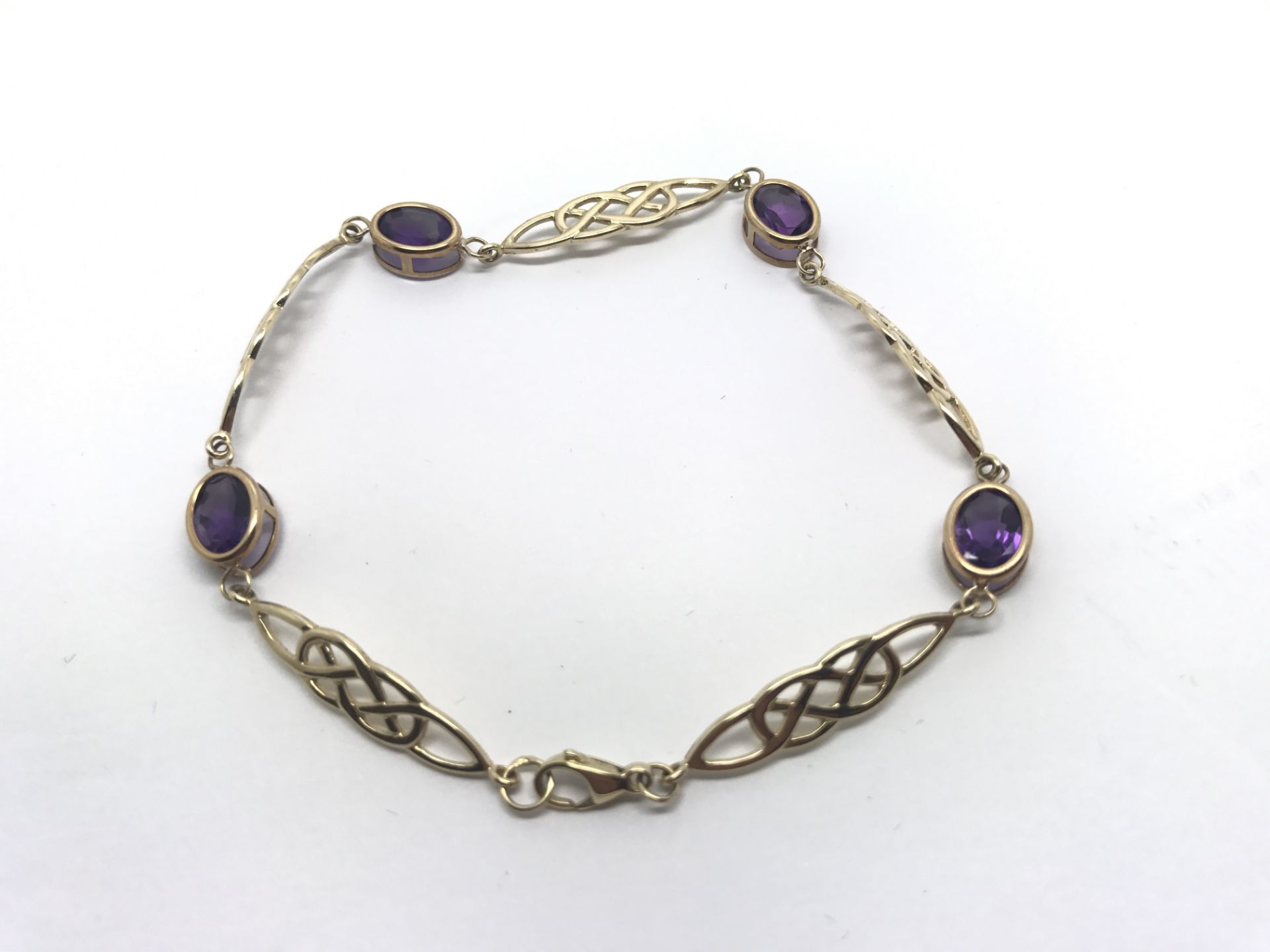 9ct GOLD AMETHYST SET CELTIC PATTERN BRACELET