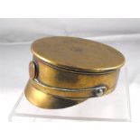 A WWI trench art paper weight or ashtray made from a 3.5 inch diameter shell case in the form of