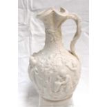 A Victorian classical shaped parian jug moulded with cherubs drinking and picking grapes 26cm high