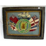 An antique sailors woolwork picture with long stitch ship and flags, "HMS Cyclops" with central