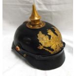 A good quality copy of a WWI Imperial German Pickelhaube Helmet, leather skull with brass fittings