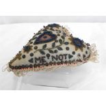 A Napoleonic forget-me-not heart shaped love token cushion, 16 by 13cm.